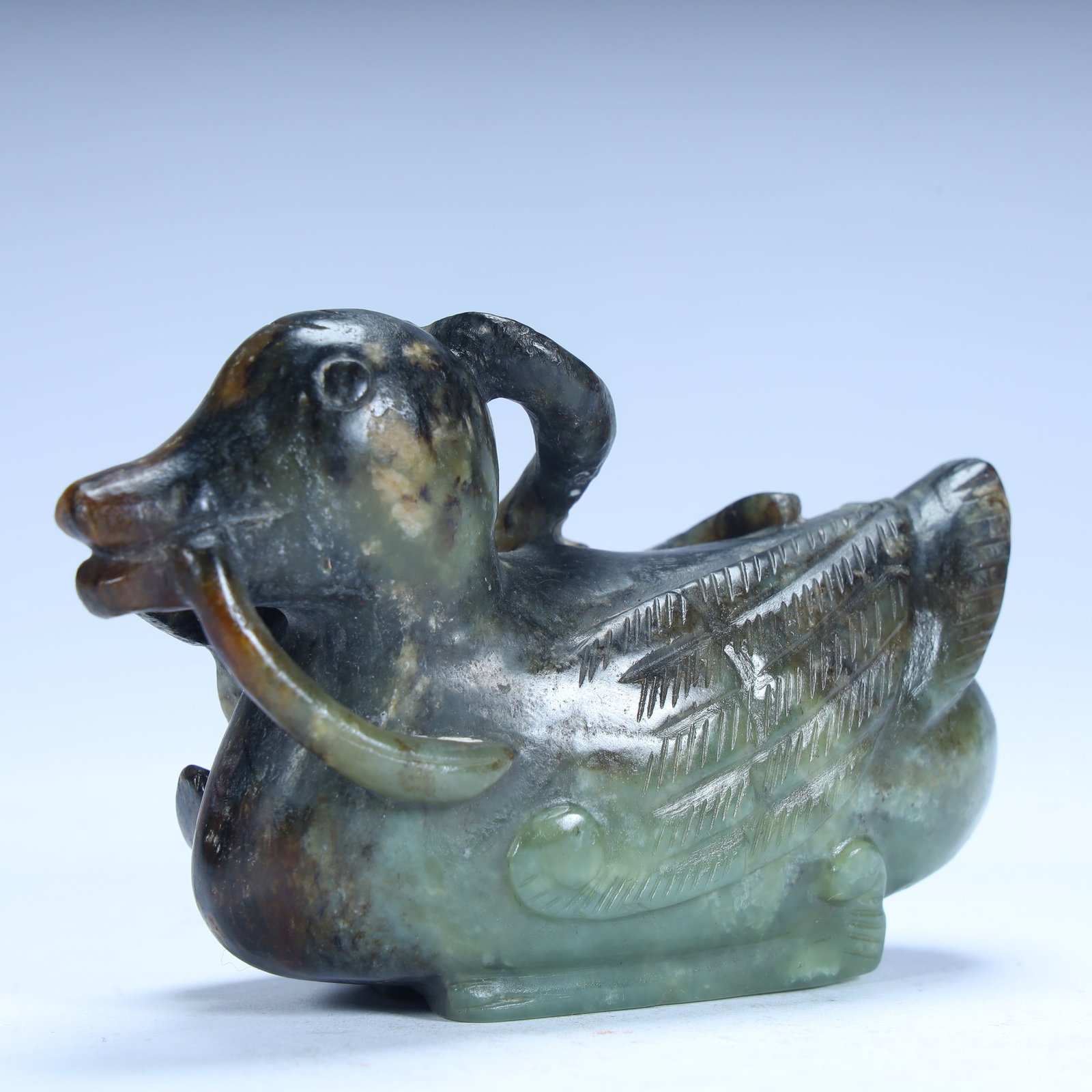 A green jade sheep's head duck body ornament: Daiqing jade sheep's head duck body ornament SIZE: H:6.5cm L:10cm W:4.5cm W:289g (The Dimensions Of All Batches Are Manually Measured.If You Need More Detailed Information, Please Contact Our