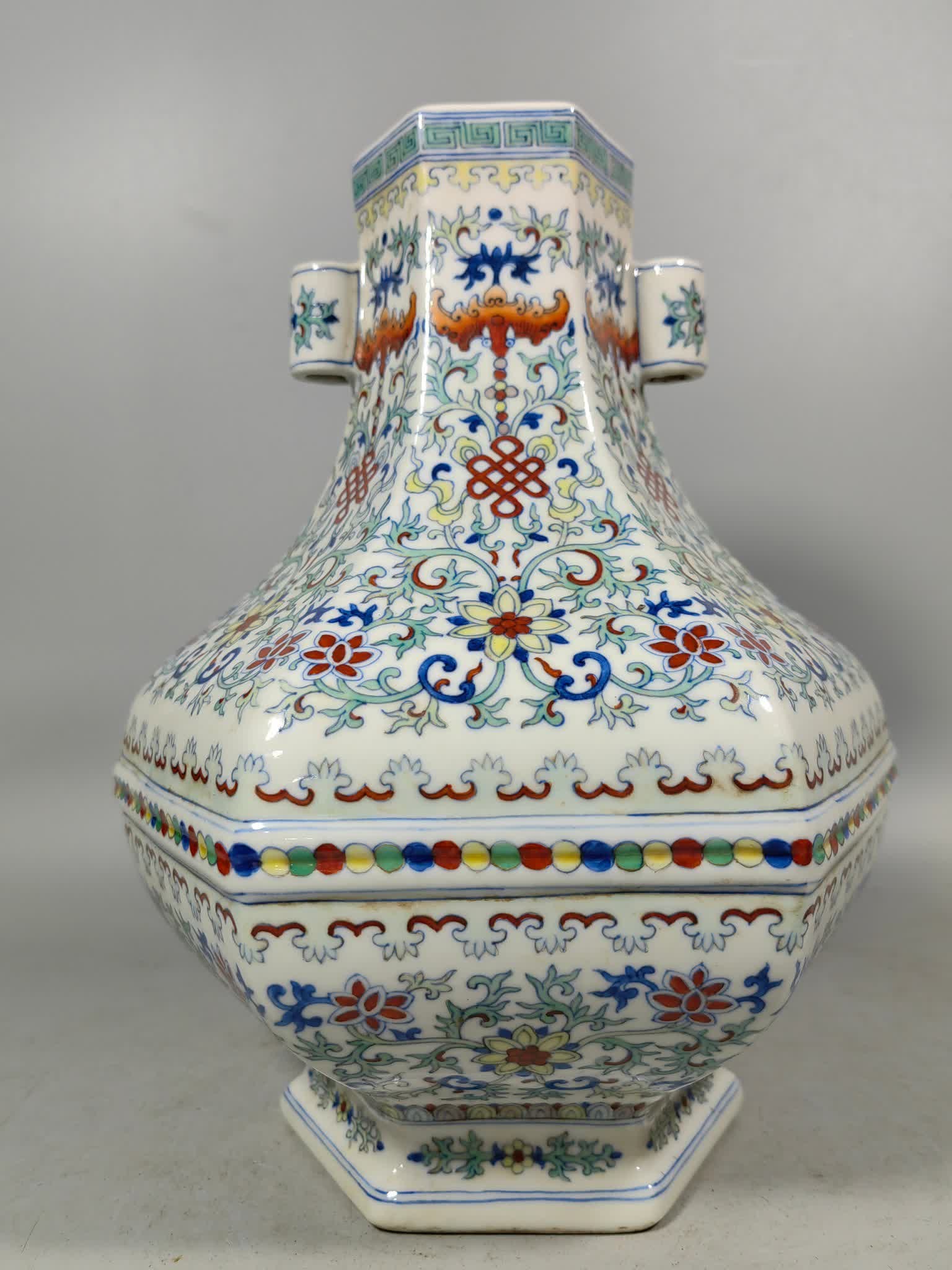 A Qing Dynasty Doucai six-square ear piercing bottle: Qing Dynasty Doucai six-square ear bottle SIZE: H:27.5cm W:23cm (The Dimensions Of All Batches Are Manually Measured.If You Need More Detailed Information, Please Contact Our Customer Service Before B