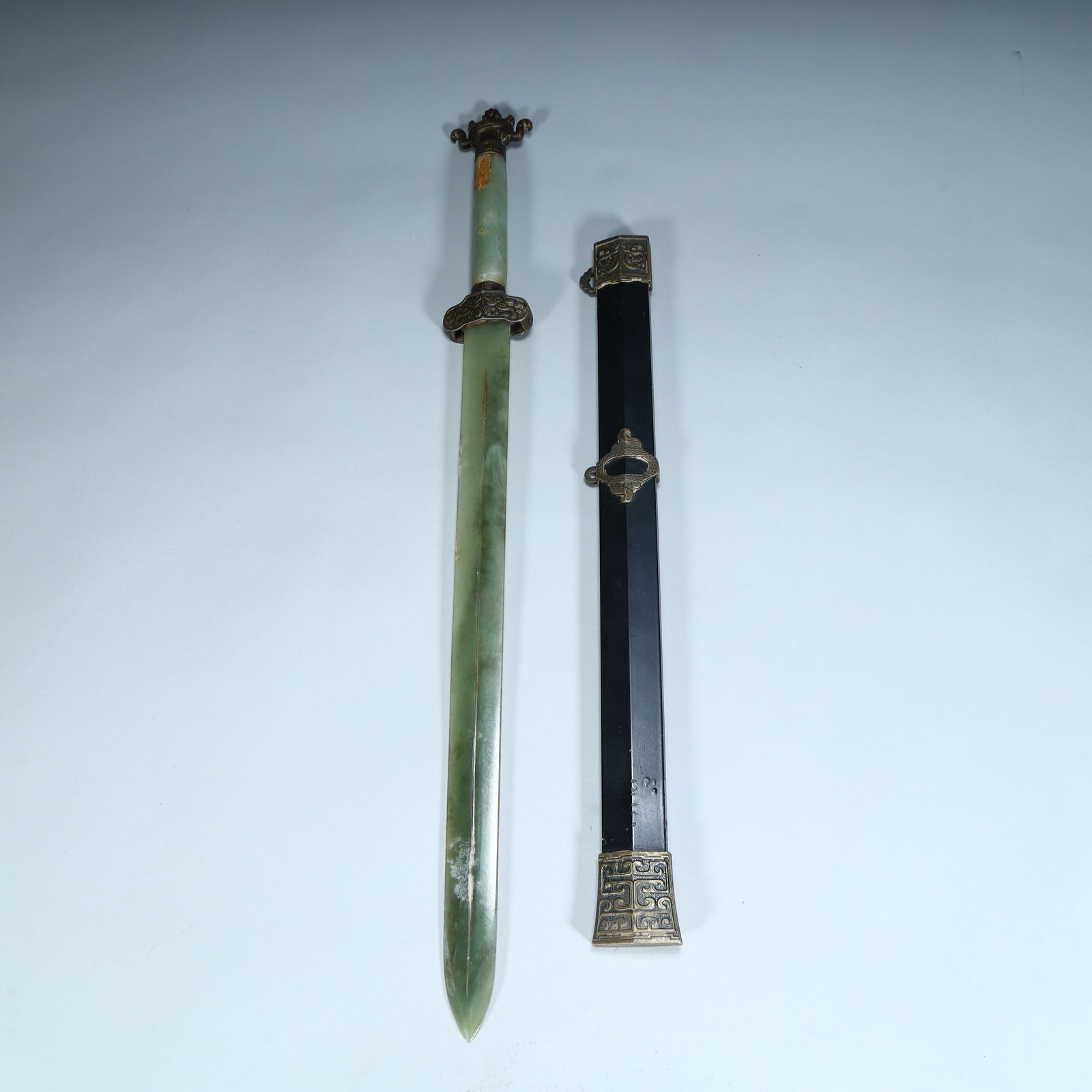 A jade sword-shaped ornament made of Qing Dynasty: Qing Dynasty jade sword-shaped ornaments SIZE: L:50cm W:4.8cm W:343g (The Dimensions Of All Batches Are Manually Measured.If You Need More Detailed Information, Please Contact Our Customer Service Bef