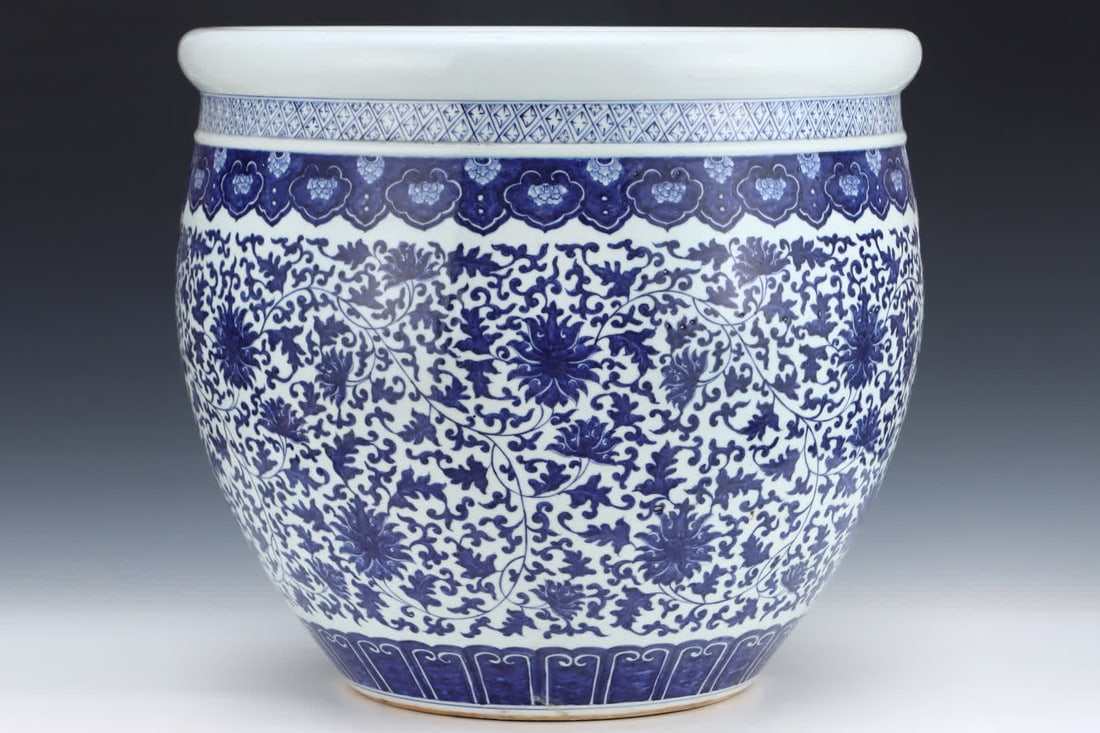 A large vat with a Qing Qianlong blue glaze intertwined lotus pattern: Qing Qianlong celadon entwined lotus pattern vat SIZE: H: 48cm Abdominal diameter 53.5cm (The Dimensions Of All Batches Are Manually Measured.If You Need More Detailed Information, Please Contact Our