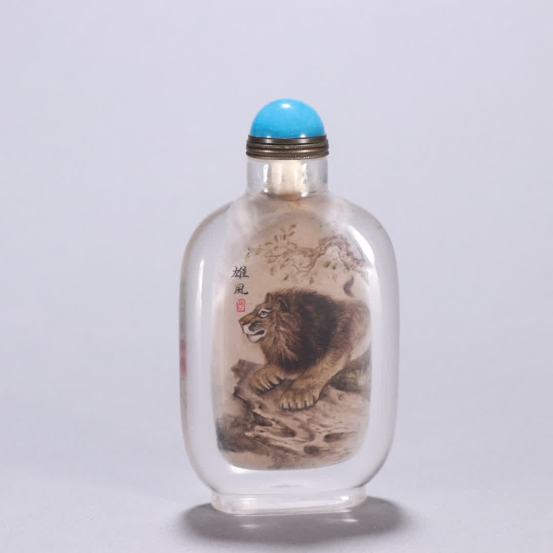A Qing Dynasty natural crystal with a lion snuff bottle painted inside: Qing Dynasty natural crystal inner painting lion snuff bottle SIZE: H:8.9cm W:4.7cm W:94.1g (The Dimensions Of All Batches Are Manually Measured.If You Need More Detailed Information, Please Contact O