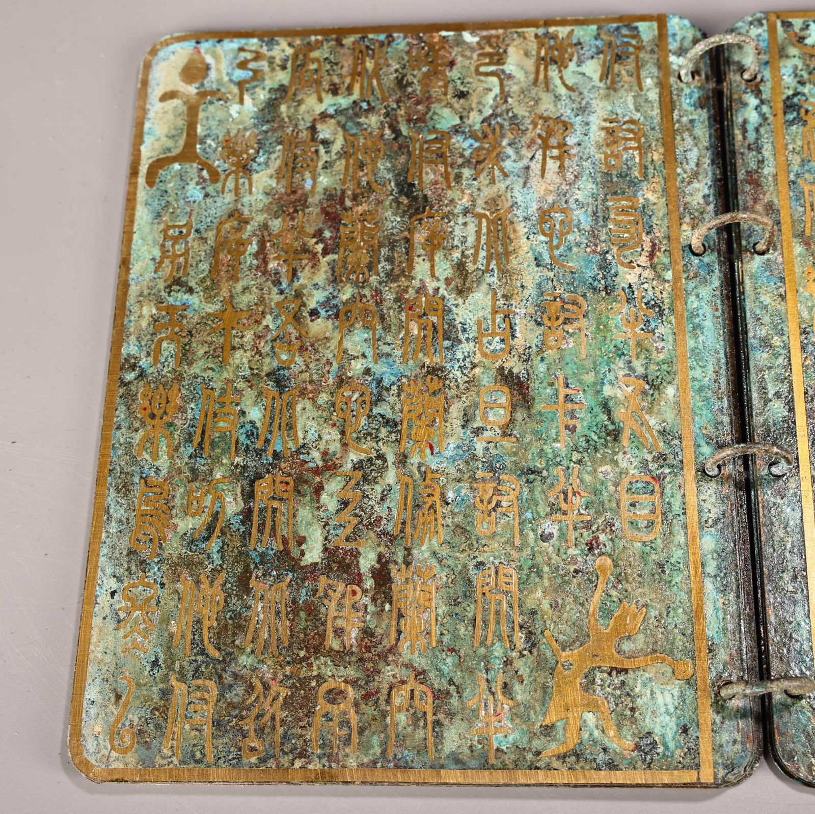 A bronze gold book - 10