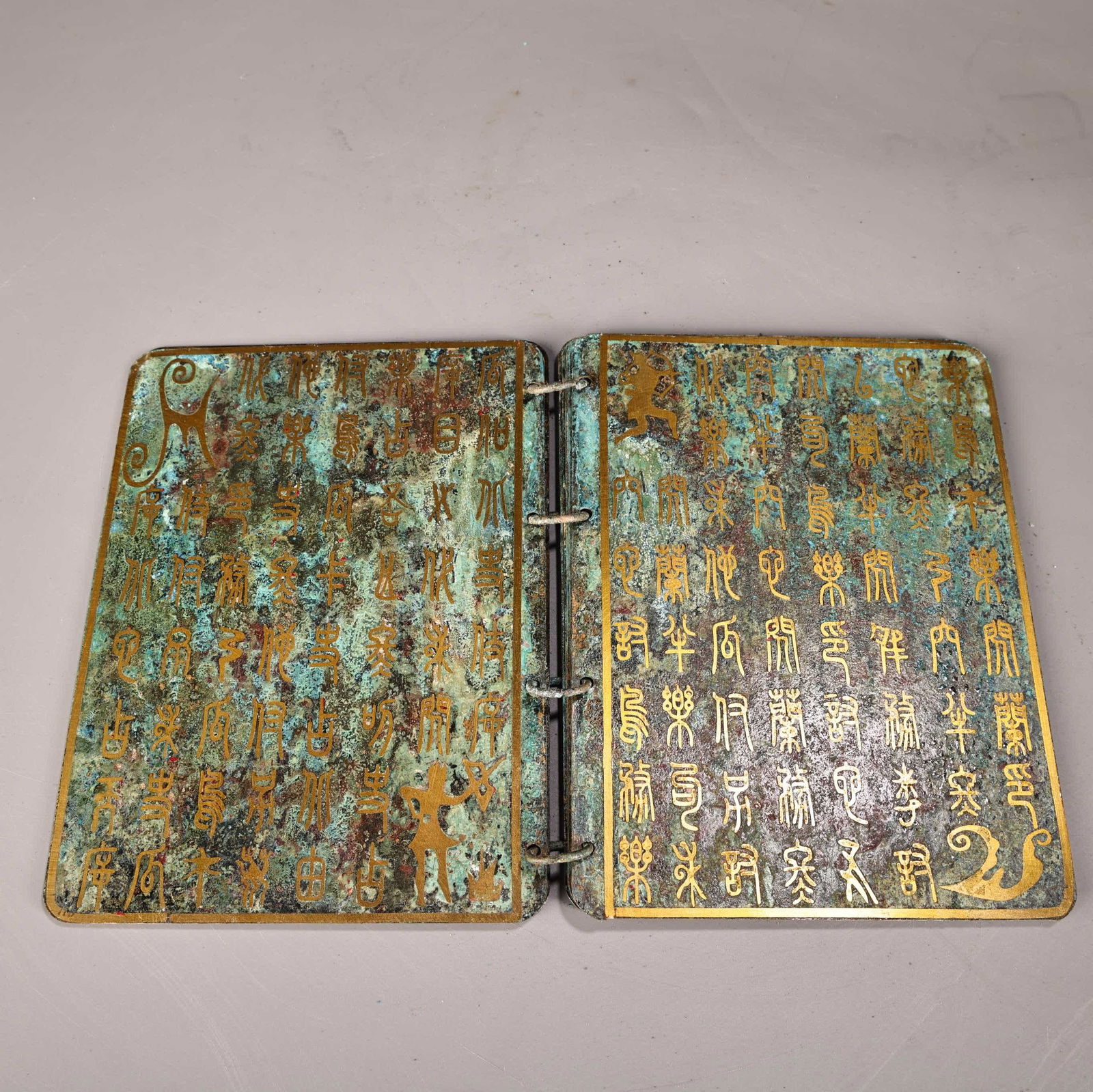 A bronze gold book - 3