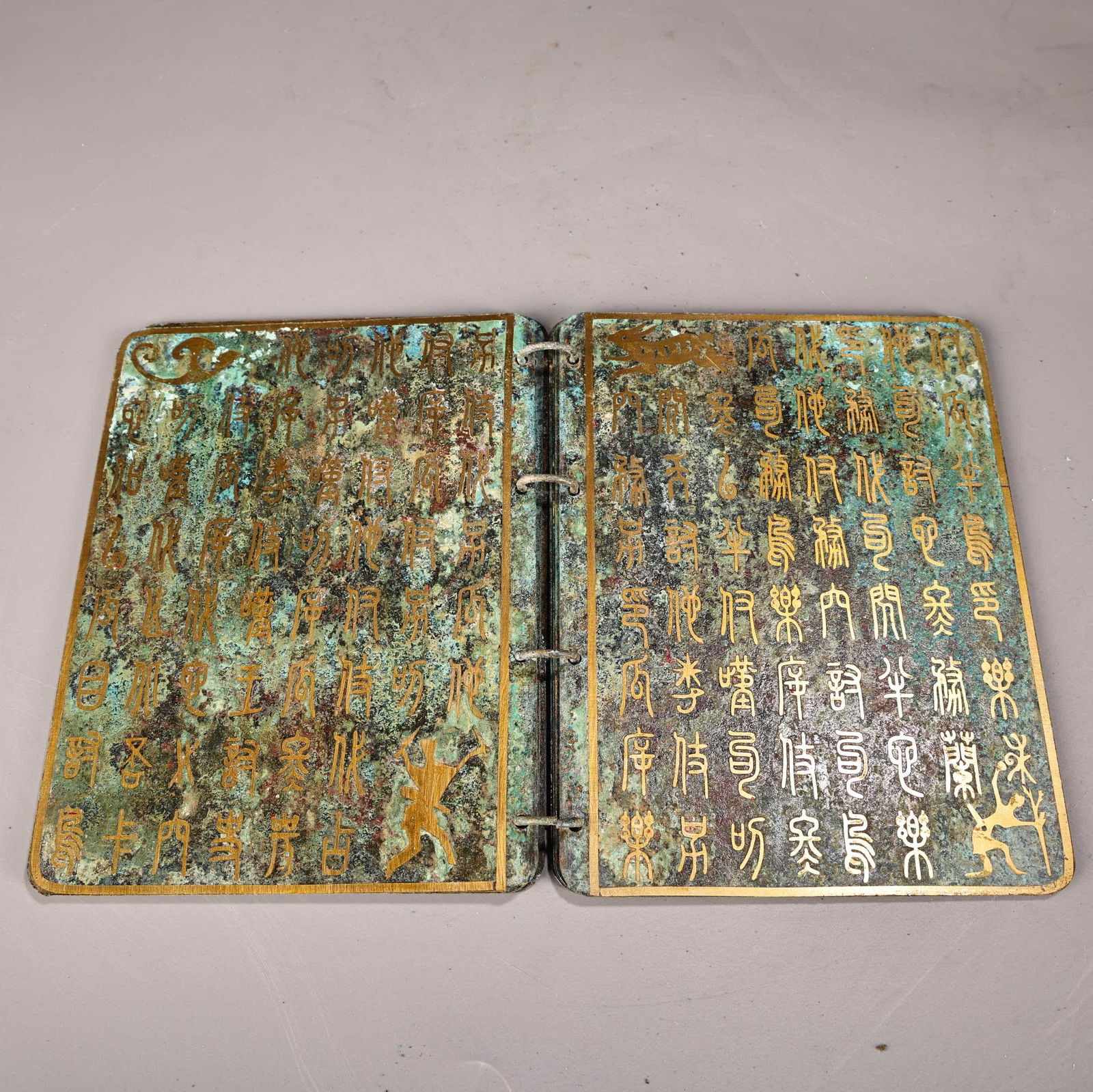 A bronze gold book - 5