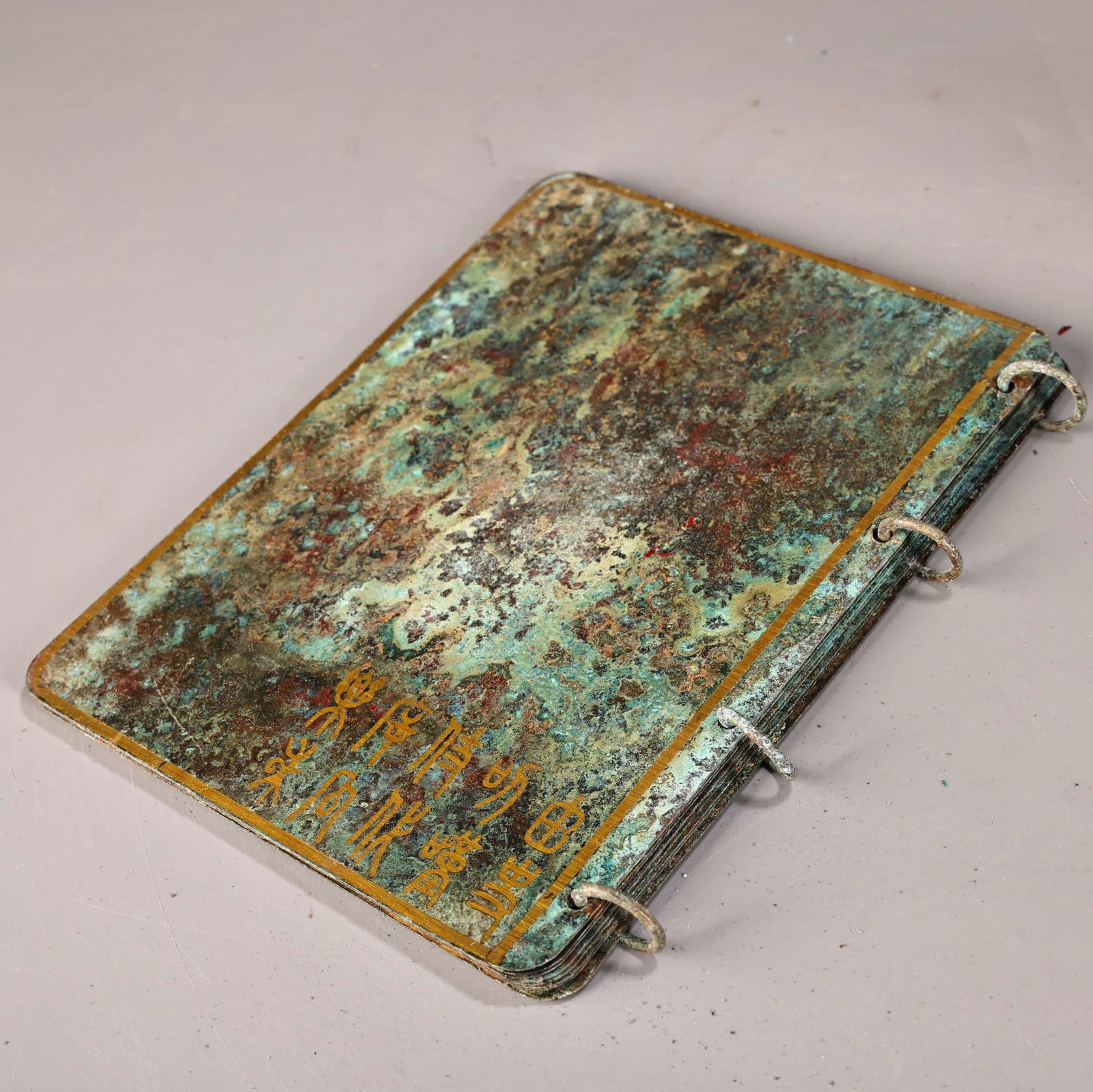 A bronze gold book - 9