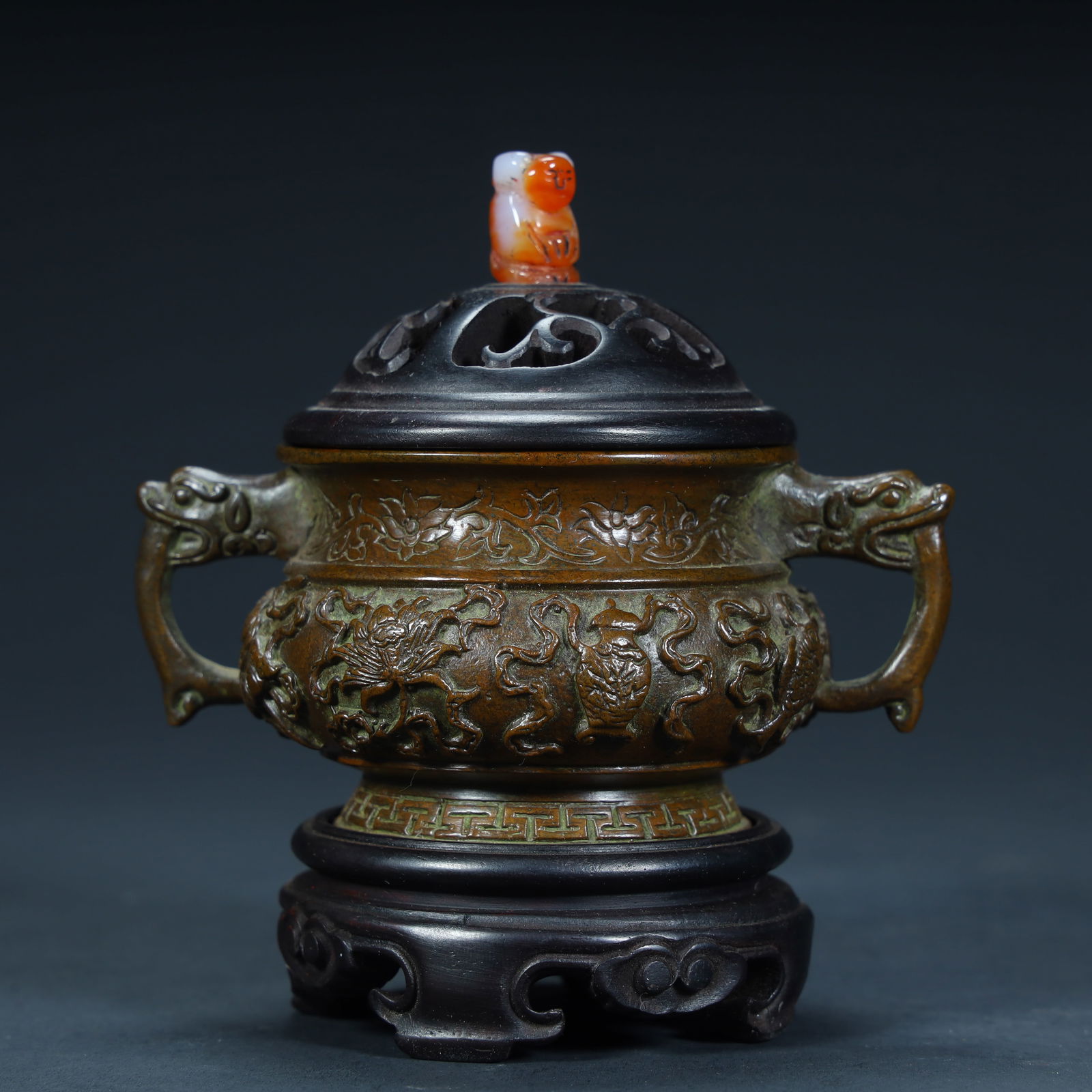 A Qing Dynasty (Qianlong period) copper tire relief auspicious beast pattern aroma burner: Qing Dynasty (Qianlong period) copper tire relief auspicious beast pattern aroma burner SIZE: H:10cm L:9.5cm W:7cm W:455g (The Dimensions Of All Batches Are Manually Measured.If You Need More Detailed