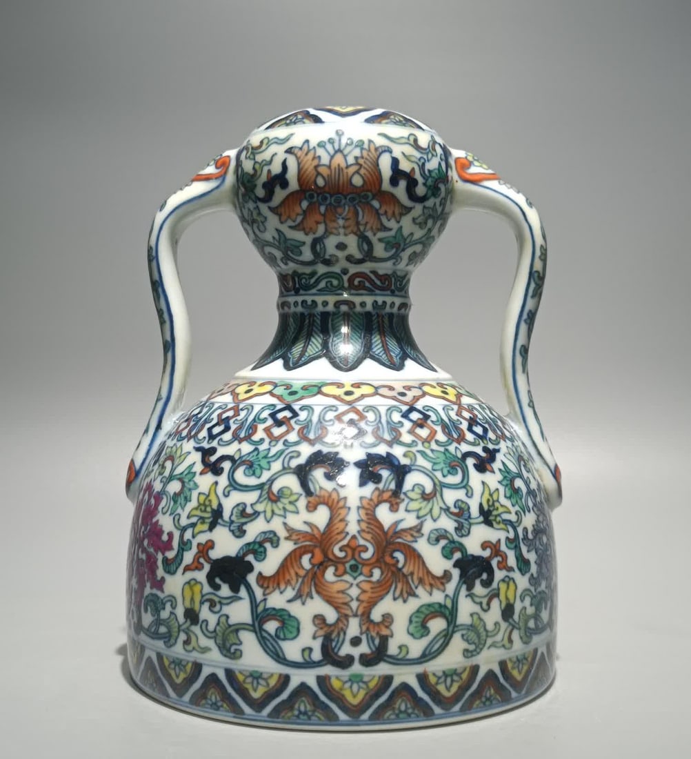 A Qing Yongzheng Doucai entwined lotus ruyi garlic head zun: Qing Yongzheng Doucai Lotus Ruyi Garlic Head Zun SIZE: H:18.5cm W:14.5cm (The Dimensions Of All Batches Are Manually Measured.If You Need More Detailed Information, Please Contact Our Customer Service