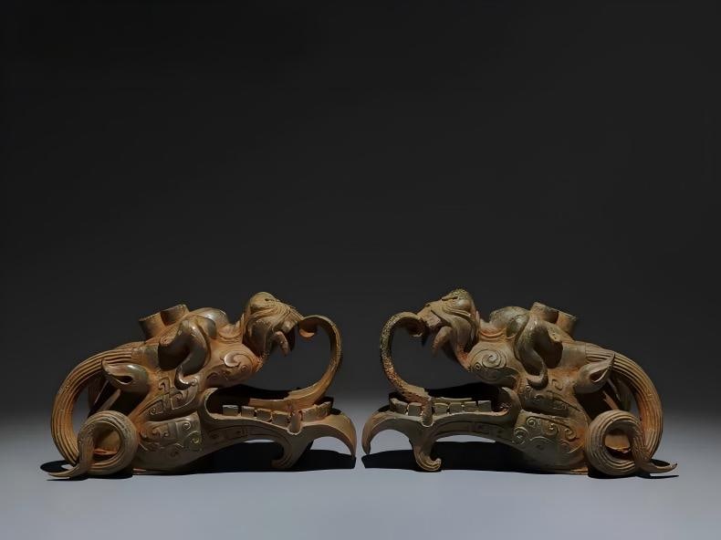 A pair of bronze dragon heads (1 of 9)