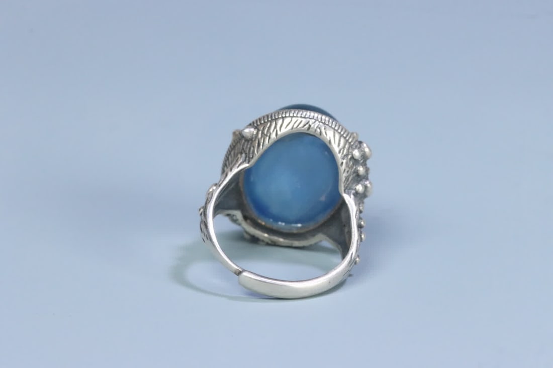 A silver support aquamarine ring on the face - 3