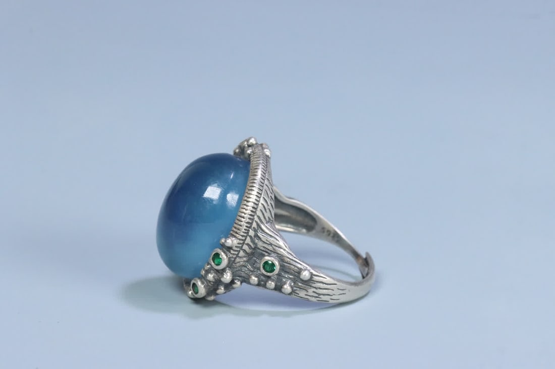 A silver support aquamarine ring on the face - 4