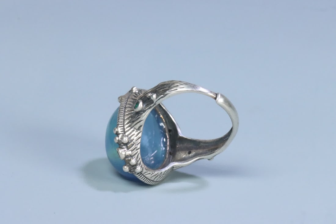 A silver support aquamarine ring on the face - 5
