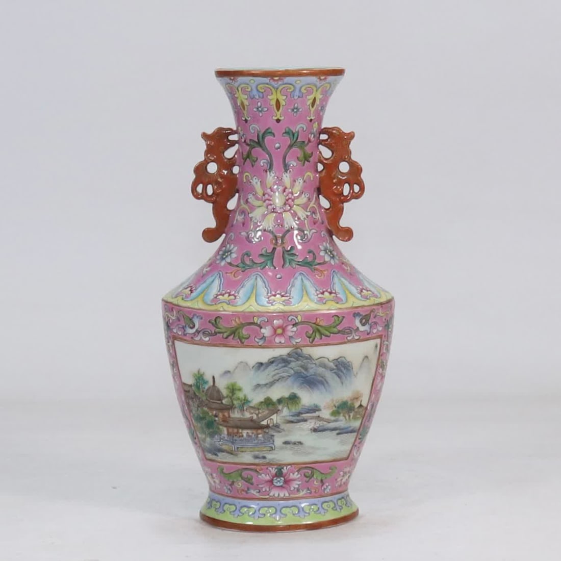 A wall bottle made in the Qianlong period of the Qing Dynasty with rouge gouache entwined flowers: Qing Qianlong year made rouge gouache entwined flower ground window landscape pattern wall bottle SIZE: H:20.8cm W:10.5cm (The Dimensions Of All Batches Are Manually Measured.If You Need More Detailed