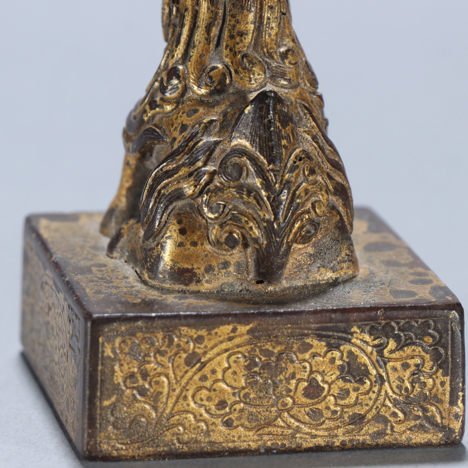 A copper gilt beast button seal - 4