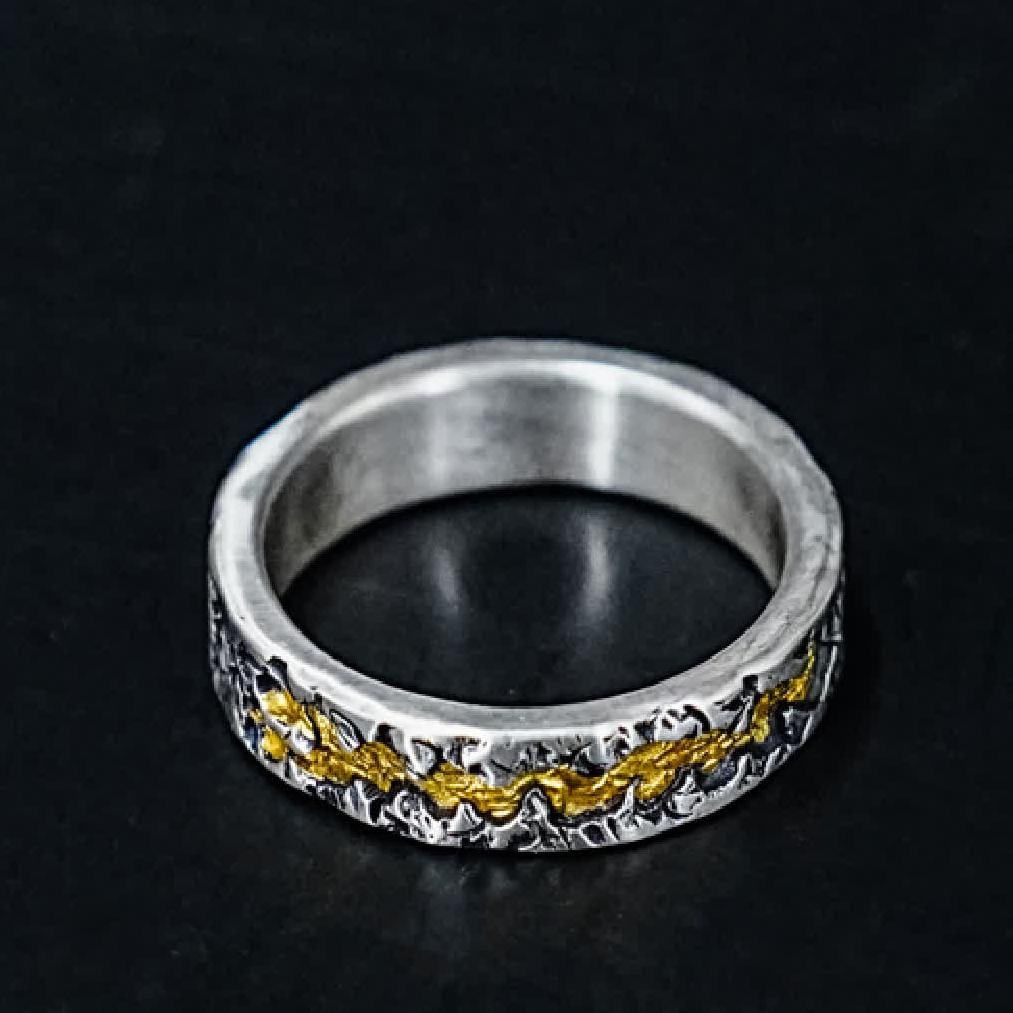 A silver gold ring - 6