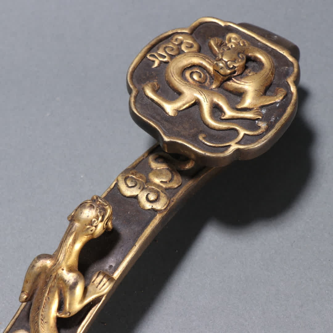 A Qing Dynasty copper gilt dragon pattern ruyi handle - 2