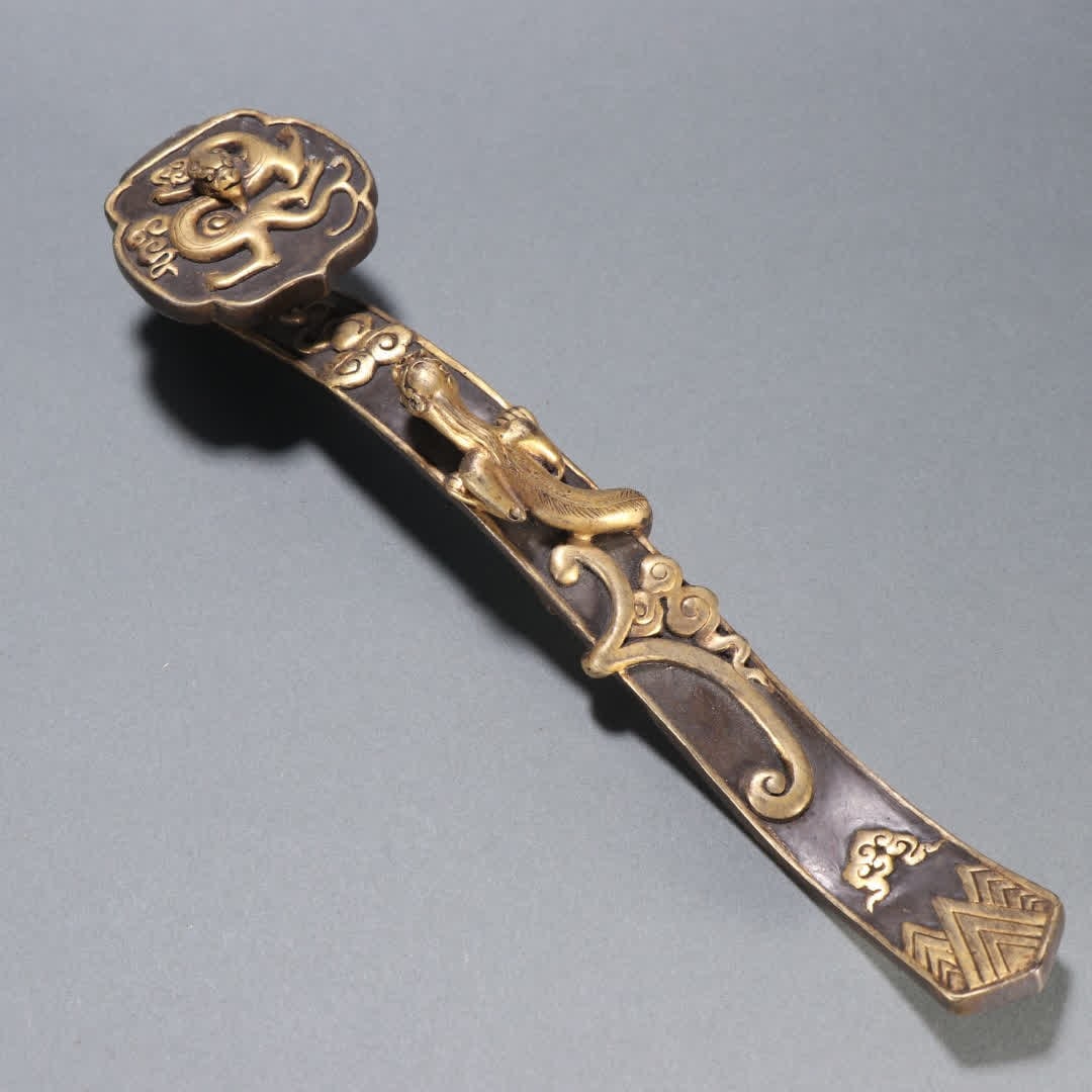 A Qing Dynasty copper gilt dragon pattern ruyi handle - 4