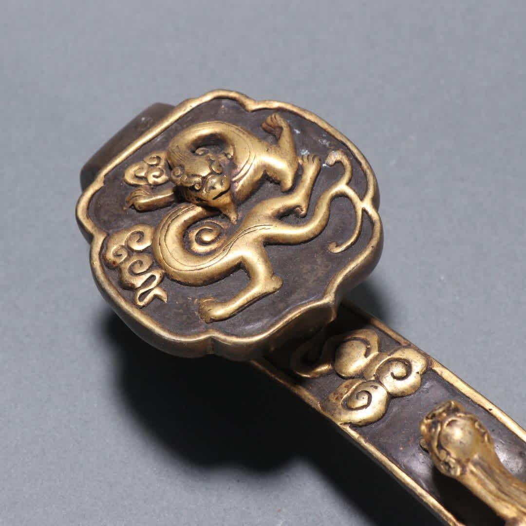 A Qing Dynasty copper gilt dragon pattern ruyi handle - 5