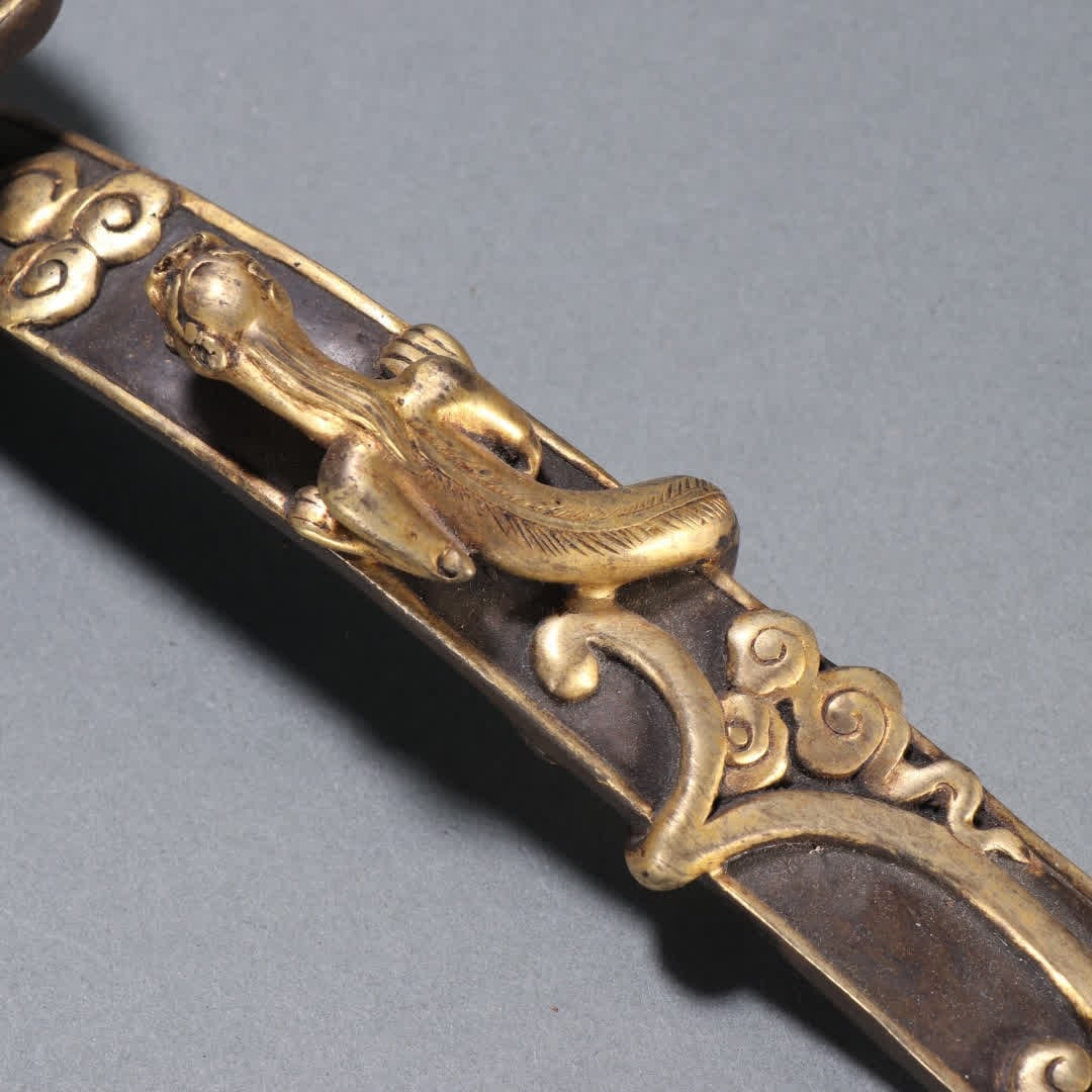 A Qing Dynasty copper gilt dragon pattern ruyi handle - 6