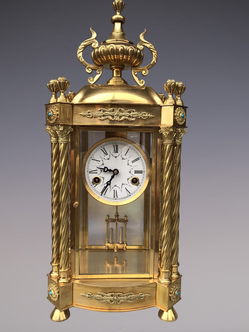 An Exquisite Gilt Bronze Lotus Pattern Clock: An Exquisite Gilt Bronze Lotus Pattern Clock Qing Dynasty, China Size:56cmx24cmx18cm (The Dimensions Of All Batches Are Manually Measured.If You Need More Detailed Information, Please Contact Our