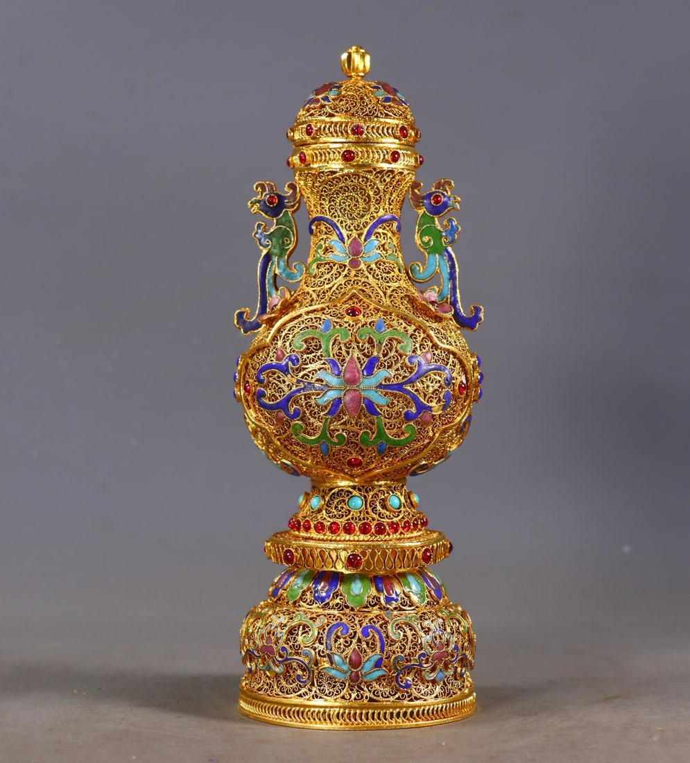 An Exquisite Gilt Bronze Inlaid Gems Lotus Pattern Double-Ears Vase: An Exquisite Gilt Bronze Inlaid Gems Lotus Pattern Double-Ears Vase Qing Dynasty, China Qianlong Four-character Mark Size:24cmx8.5cm Weight:493g (The Dimensions Of All Batches Are Manually