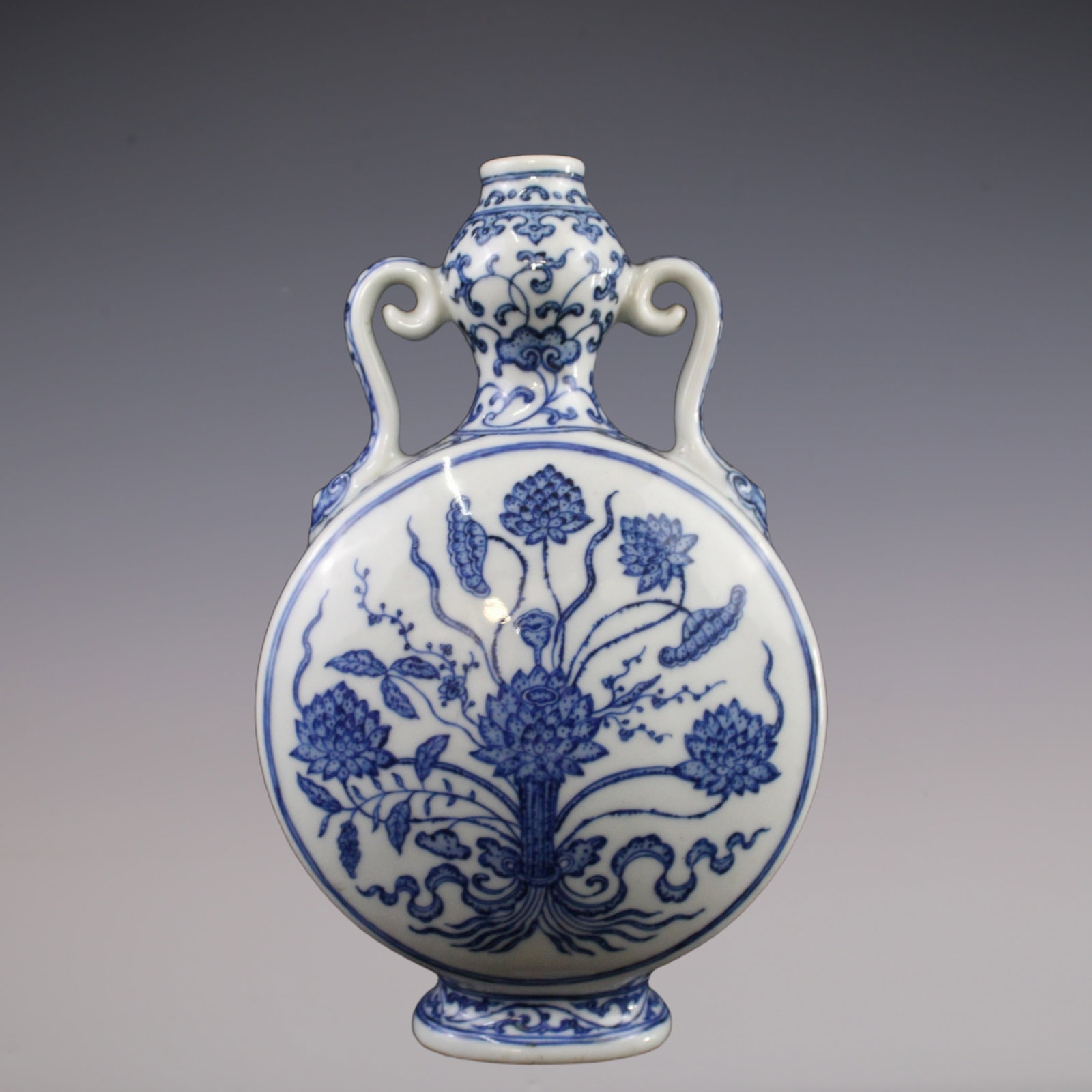 An Exquisite Blue and White Flower Pattern Lotus Pattern Double-Ears Vase: An Exquisite Blue and White Flower Pattern Lotus Pattern Double-Ears Vase Qing Dynasty, China Qianlong Six-character Mark Size:21cmx6cm (The Dimensions Of All Batches Are Manually Measured.If You Need