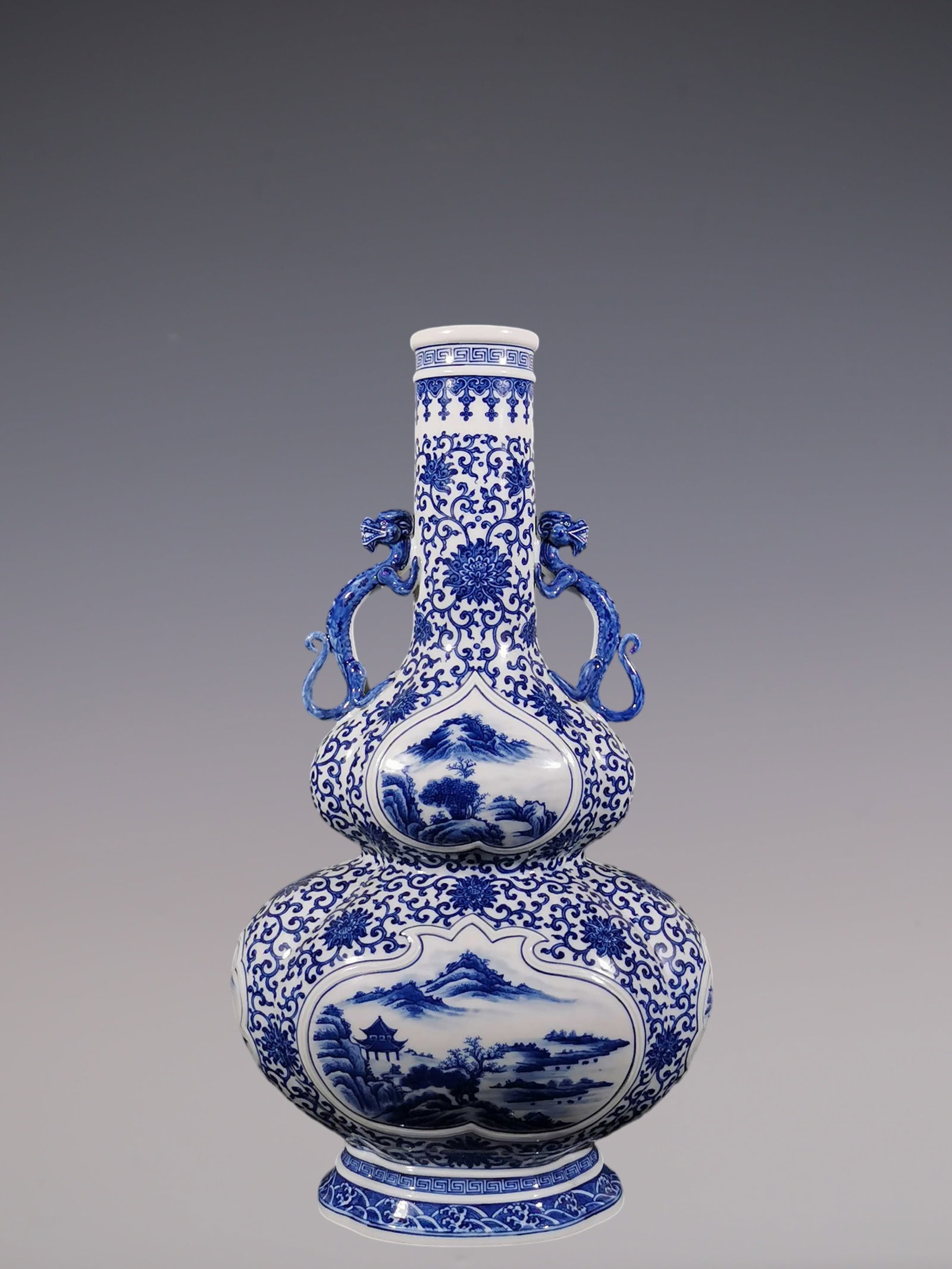An Exquisite Blue and White Lotus Pattern Landscape Pattern Seawater Pattern Gourd-Shaped: An Exquisite Blue and White Lotus Pattern Landscape Pattern Seawater Pattern Gourd-Shaped Double-Ears Vase Qing Dynasty, China Yongzheng Six-character Mark Size:50.6cmx27cm (The Dimensions Of All