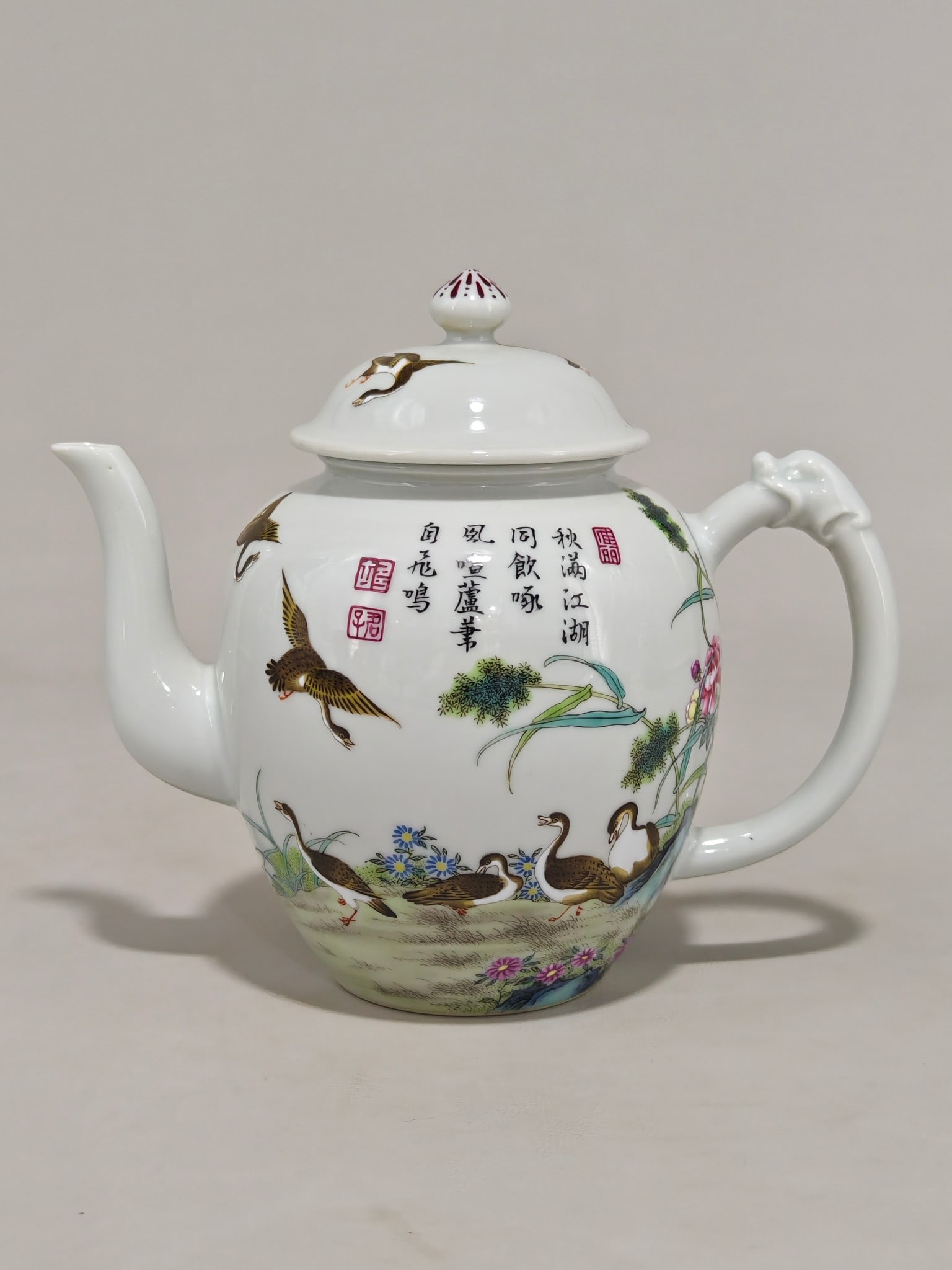 An Exquisite Famille-Rose Flower and Bird Pattern with poem Teapot: An Exquisite Famille-Rose Flower and Bird Pattern with poem Teapot Qing Dynasty, China Yongzheng Six-character Mark Size:14.5cmx17cm (The Dimensions Of All Batches Are Manually Measured.If You Need Mo
