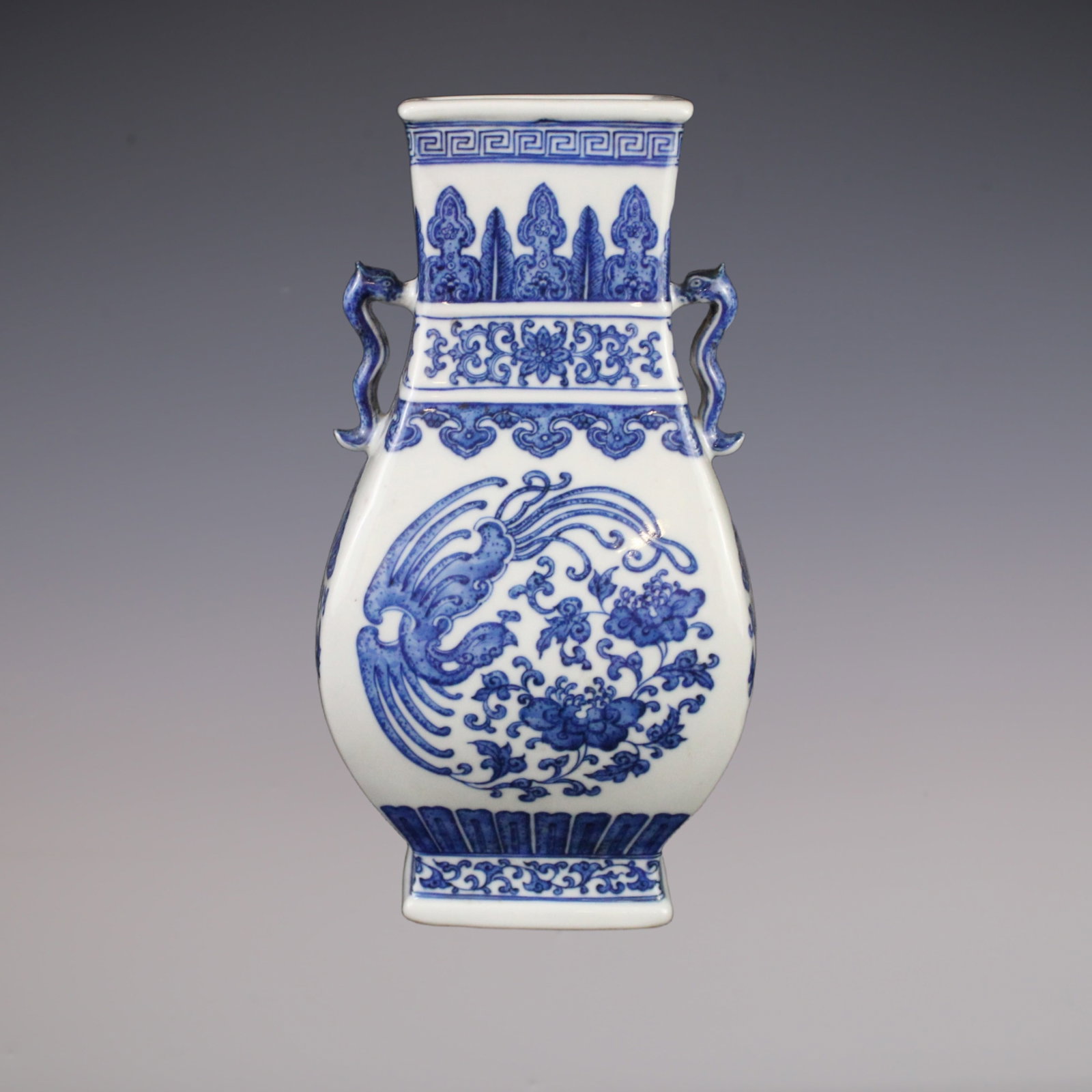 An Exquisite Blue and White Phoenix Pattern Lotus Pattern Double-Ears Vase: An Exquisite Blue and White Phoenix Pattern Lotus Pattern Double-Ears Vase Qing Dynasty, China Qianlong Six-character Mark Size:25cmx8.5cm (The Dimensions Of All Batches Are Manually Measured.If You