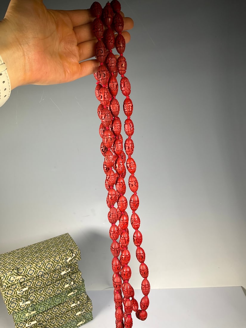 An Exquisite Carved Red Lacquer Necklace: An Exquisite Carved Red Lacquer Necklace Modern Time of China Size:84cmx2.1cm (The Dimensions Of All Batches Are Manually Measured.If You Need More Detailed Information, Please Contact Our Customer Se