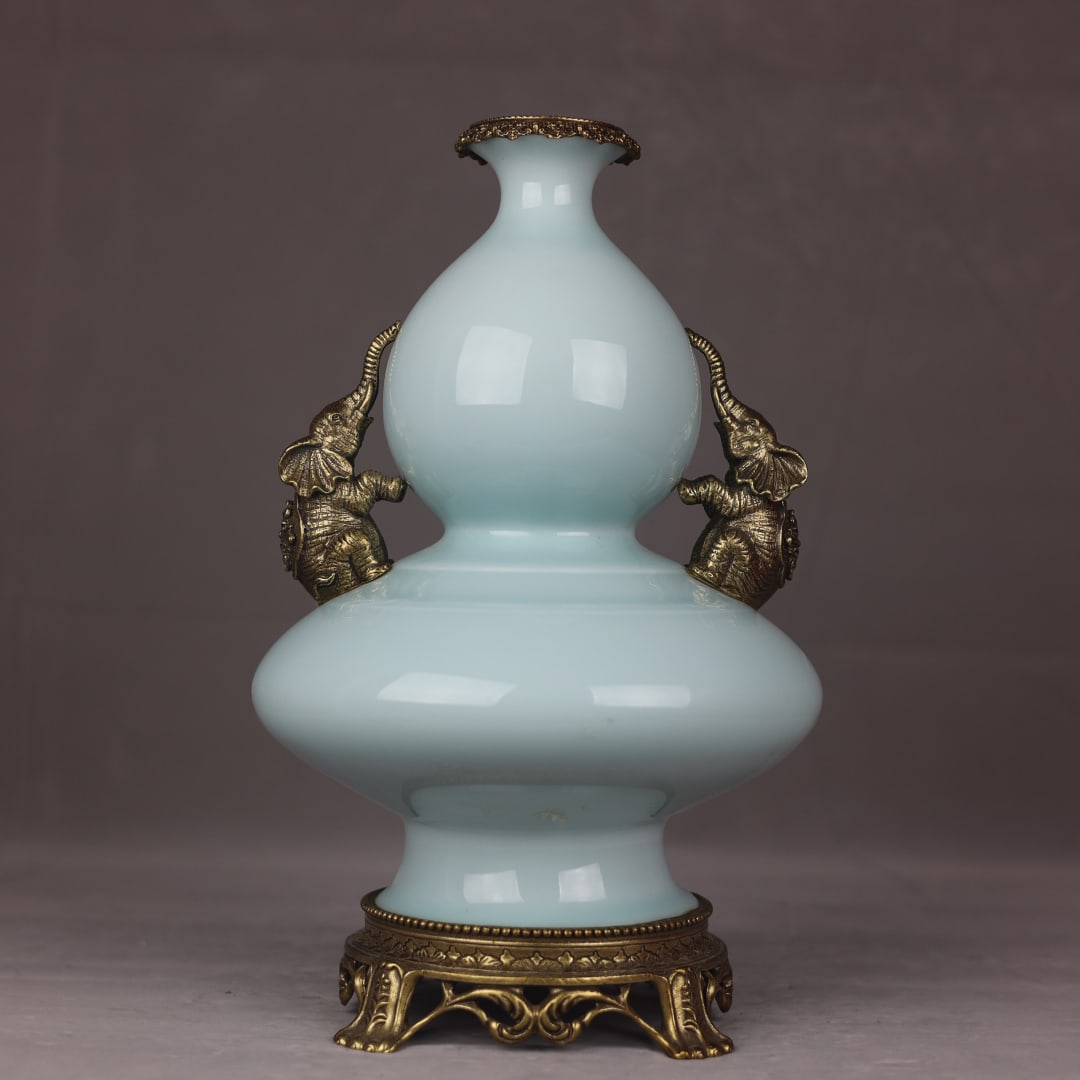 An Exquisite Shadow Blue Glaze Inlaid Bronze Gourd-Shaped Double-Ears Vase: An Exquisite Shadow Blue Glaze Inlaid Bronze Gourd-Shaped Double-Ears Vase Qing Dynasty, China Qianlong Six-character Mark Size:39cmx22cm (The Dimensions Of All Batches Are Manually Measured.If You Ne