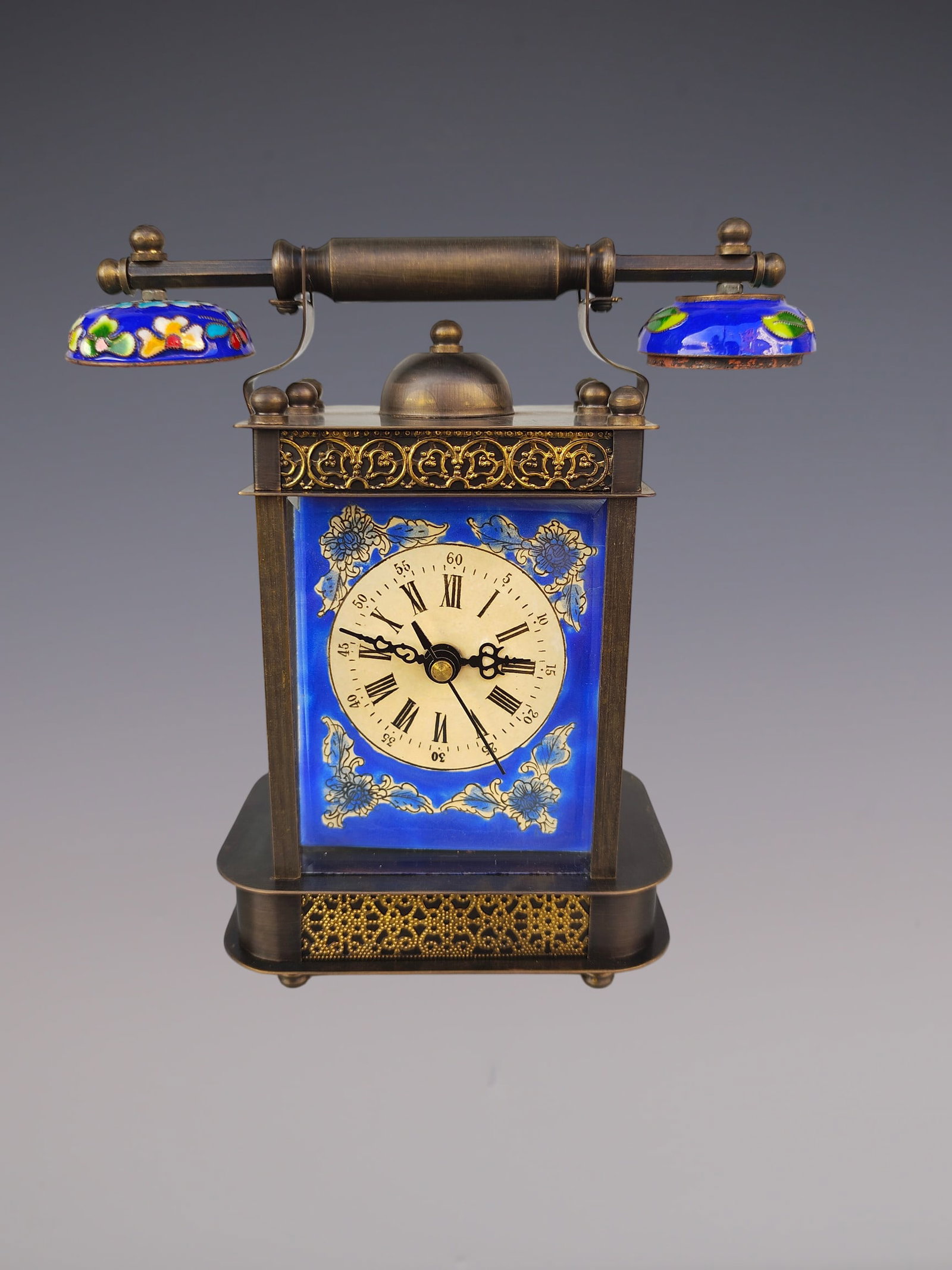 An Exquisite Bronze Lotus Pattern Clock: An Exquisite Bronze Lotus Pattern Clock Qing Dynasty, China Size:9cmx18cmx20cm (The Dimensions Of All Batches Are Manually Measured.If You Need More Detailed Information, Please Contact Our Customer