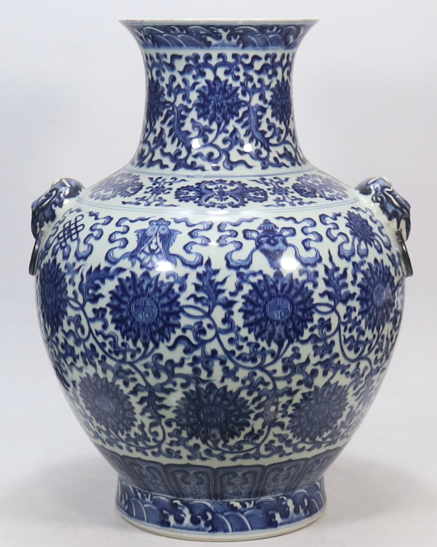 An Exquisite Blue and White Lotus Pattern Eight Treasures Pattern Double-Ears Vase: An Exquisite Blue and White Lotus Pattern Eight Treasures Pattern Double-Ears Vase Qing Dynasty, China Qianlong Six-character Mark Size:53.5cmx21cm (The Dimensions Of All Batches Are Manually