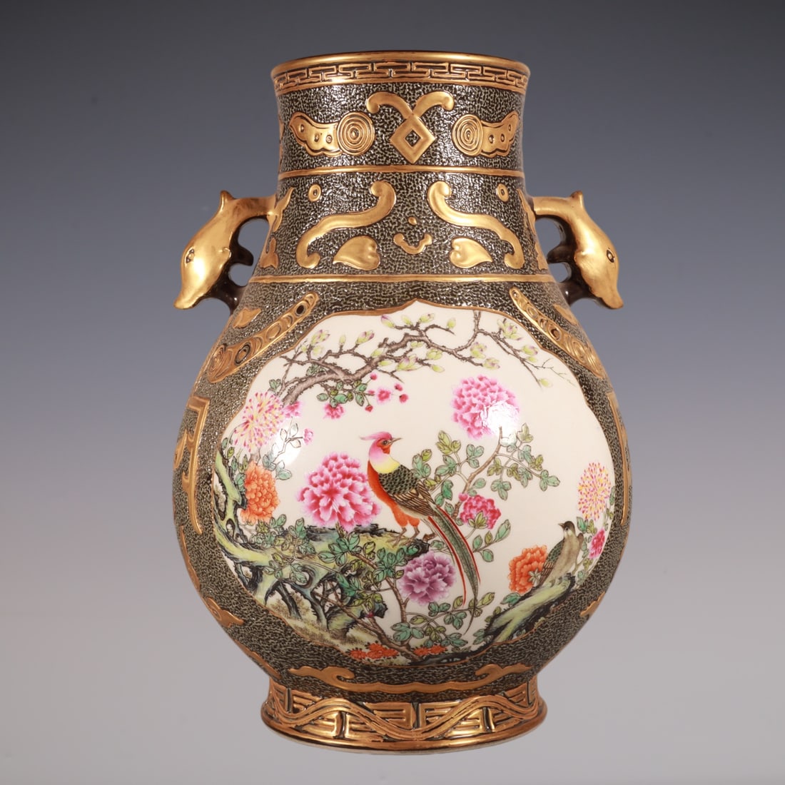 An Exquisite Enamel Painted Gold Flower and Bird Pattern Double-Ears Vase: An Exquisite Enamel Painted Gold Flower and Bird Pattern Double-Ears Vase Qing Dynasty, China Qianlong Six-character Mark Size:27.6cmx19cm (The Dimensions Of All Batches Are Manually Measured.If You