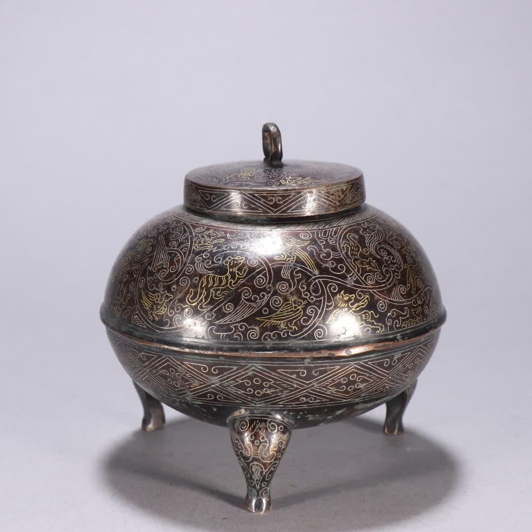 A Han Dynasty copper gold and silver tripod: Han Dynasty copper gold and silver three-legged tripod SIZE: H:10.5cm W:10cm W:545.6g (The Dimensions Of All Batches Are Manually Measured.If You Need More Detailed Information, Please Contact Our
