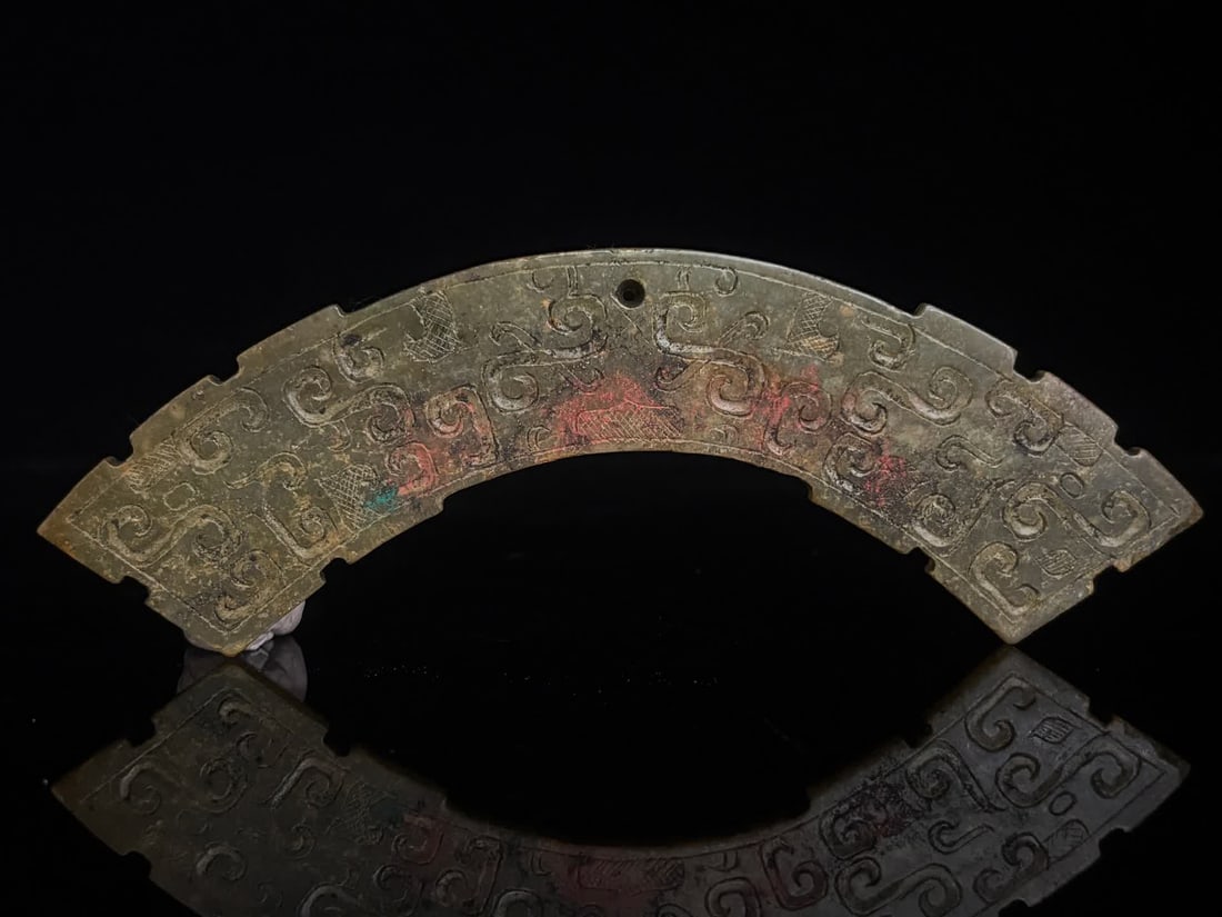 A Han Dynasty dragon pattern jade huang (1 of 9)
