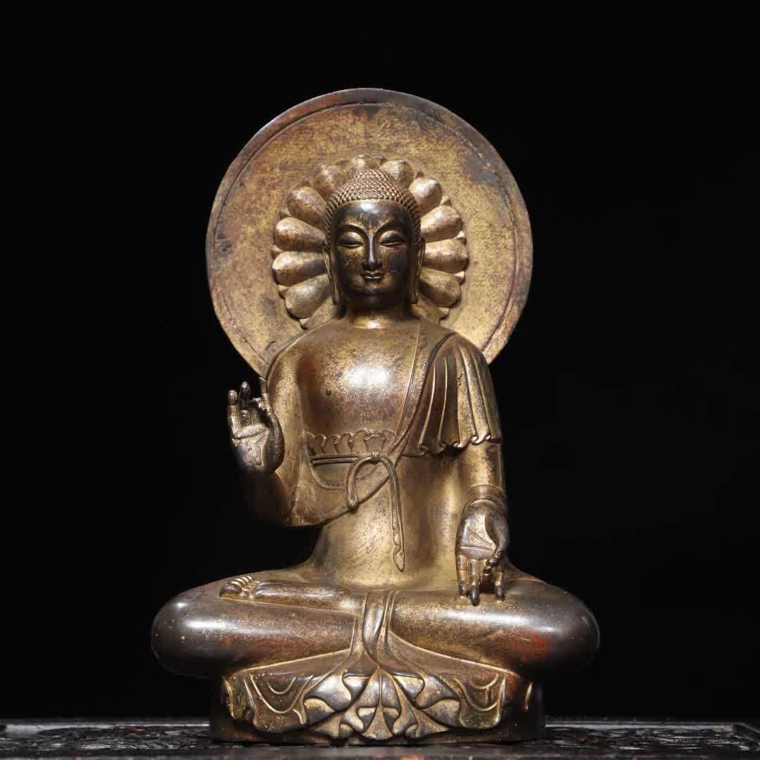 A Northern Wei bronze clay gold statue: Northern Wei bronze clay gold statue SIZE: H:27cm W:17cm T:12cm W:2.155kg (The Dimensions Of All Batches Are Manually Measured.If You Need More Detailed Information, Please Contact Our Customer
