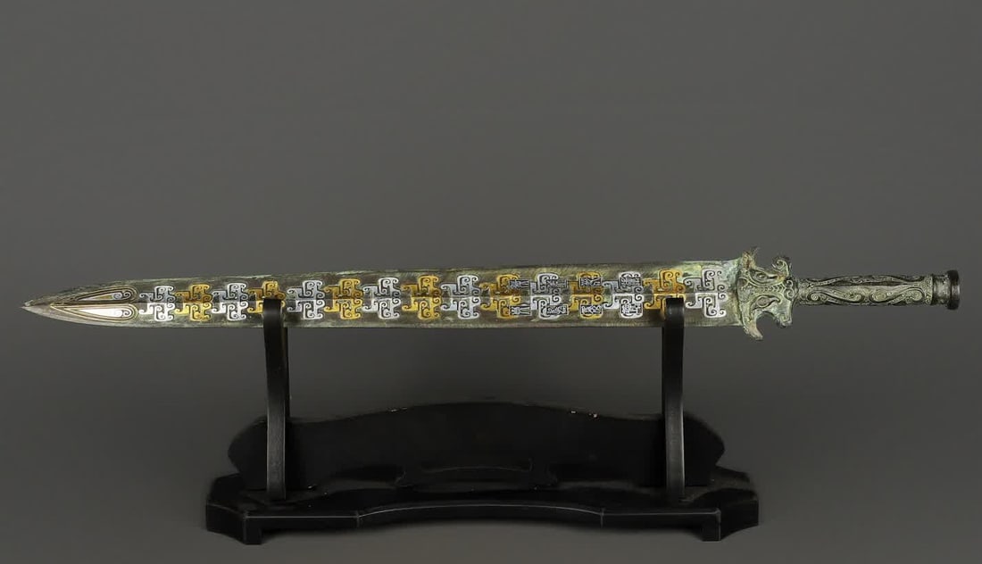 A Han Dynasty bronze Cuo gold and silver inscription sword: Han Dynasty bronze Cuo gold and silver inscription sword SIZE: W:820g L:65.5cm W:7cm (The Dimensions Of All Batches Are Manually Measured.If You Need More Detailed Information, Please Contact Our