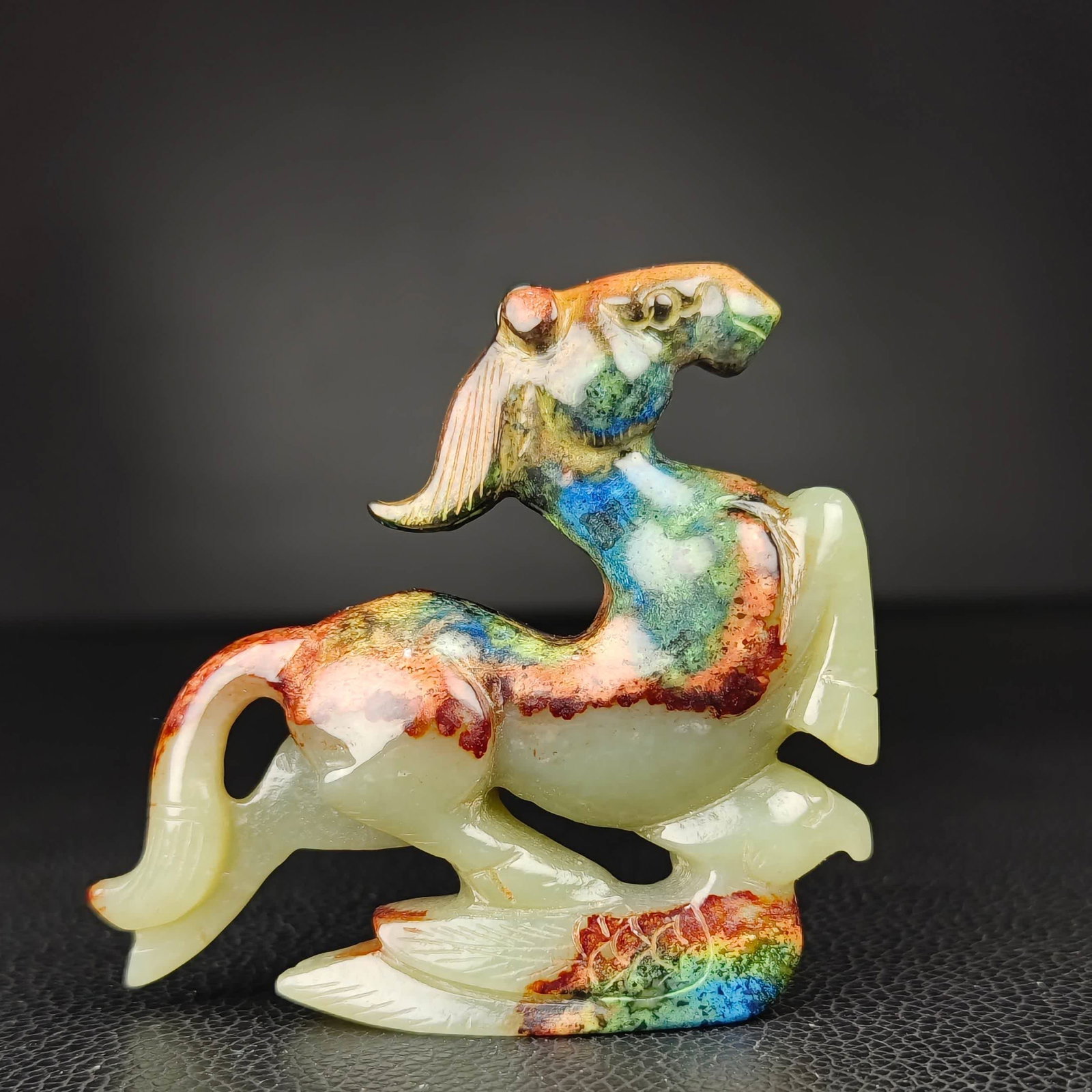 A Han Dynasty Hetian jade horse stepping on Feiyan: Han Dynasty Hetian jade horse stepped on the flying swallow SIZE: W:7cm H:6.5cm W:76g (The Dimensions Of All Batches Are Manually Measured.If You Need More Detailed Information, Please Contact Our