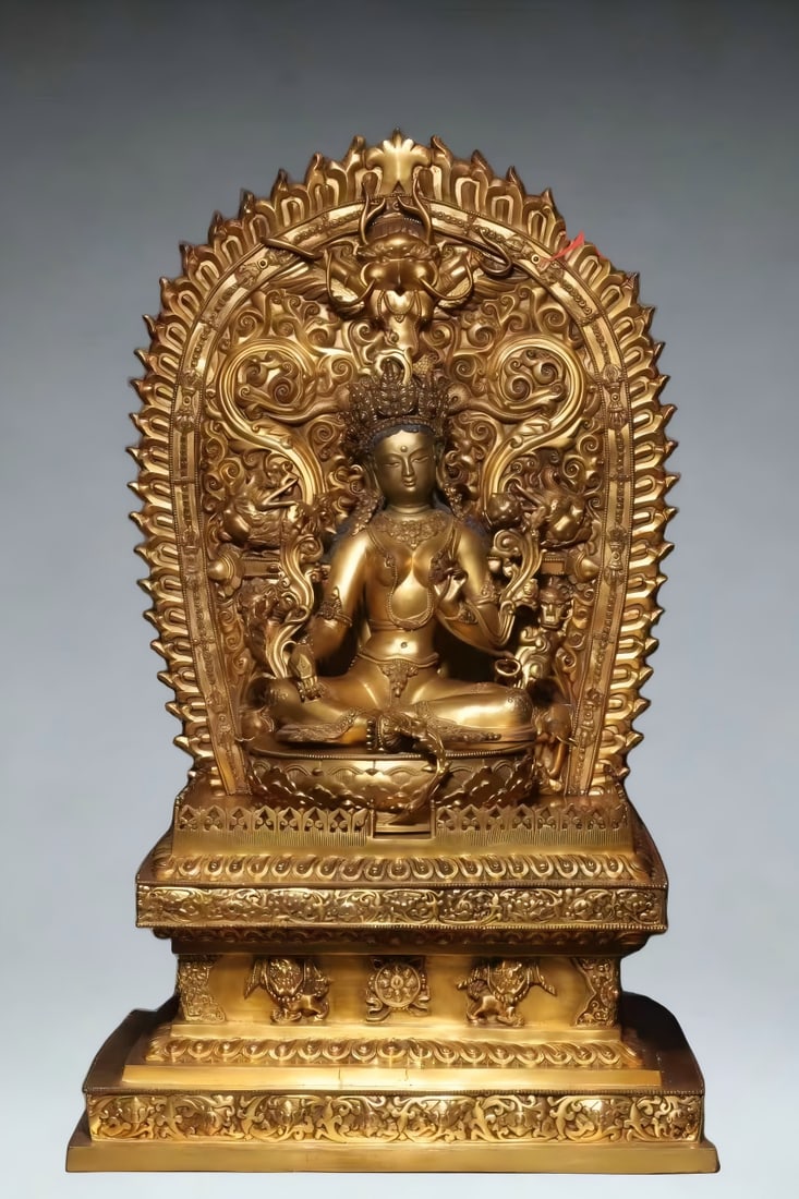 A large statue of Ming Dynasty backlit with copper gilt white Tara: This statue is huge in size and exquisitely shaped, which is very rare. Tara wears a flower crown on her head, with a high bun and beads; The face is square and round, with a high nose and thin lips, 