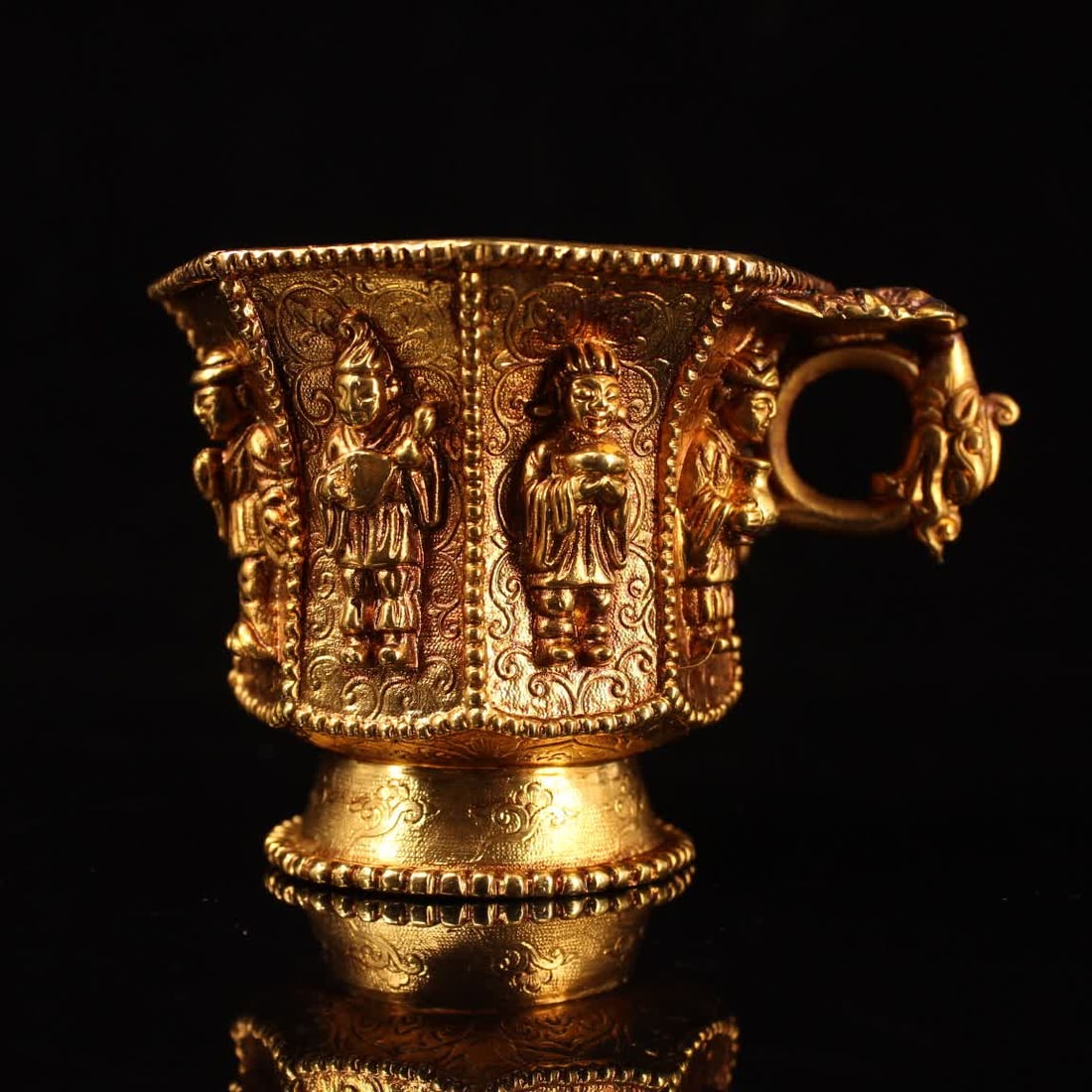 A Qing Dynasty carved gilt Eight Immortals cup (1 of 9)