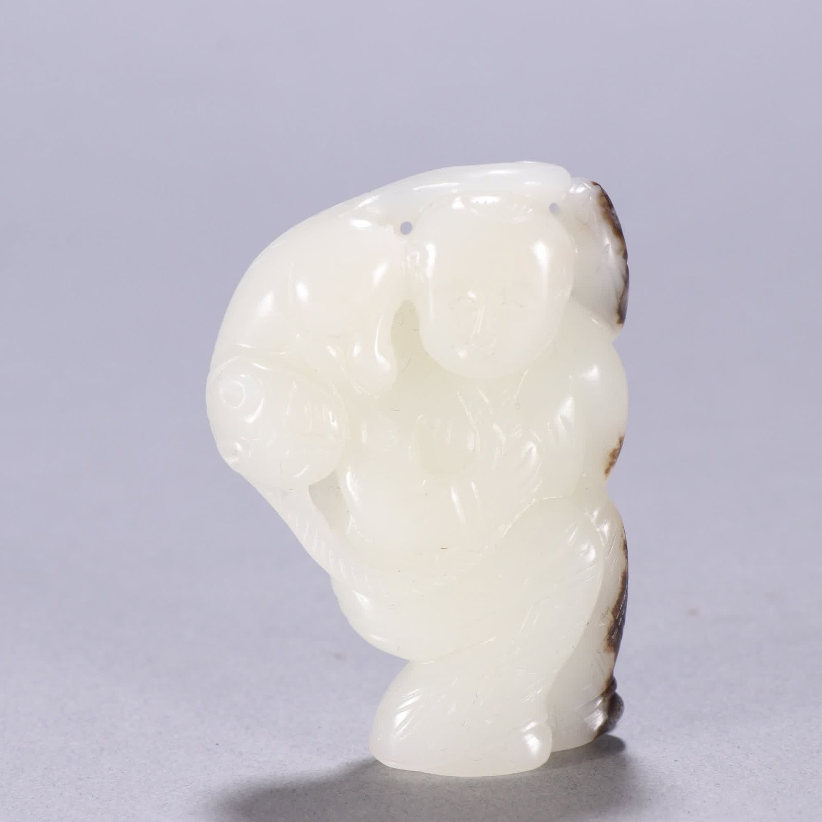A Qing Dynasty Hetian jade seed material boy playing with beasts (1 of 9)