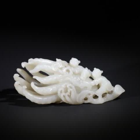 A Qing Dynasty white jade Buddha's hand wishful boy (1 of 12)
