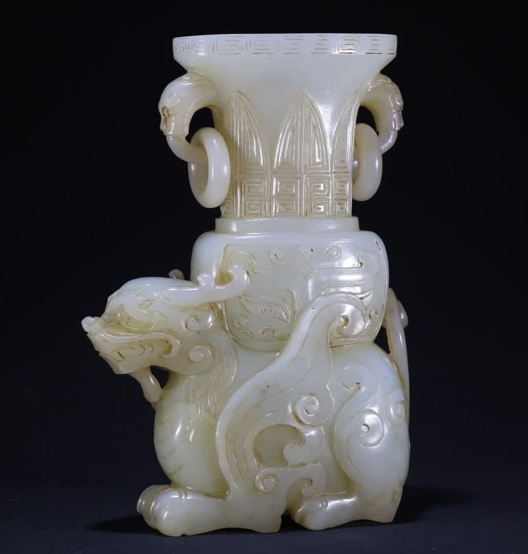 A Qing Dynasty white jade beast carrying bottle living ring ornament (1 of 10)