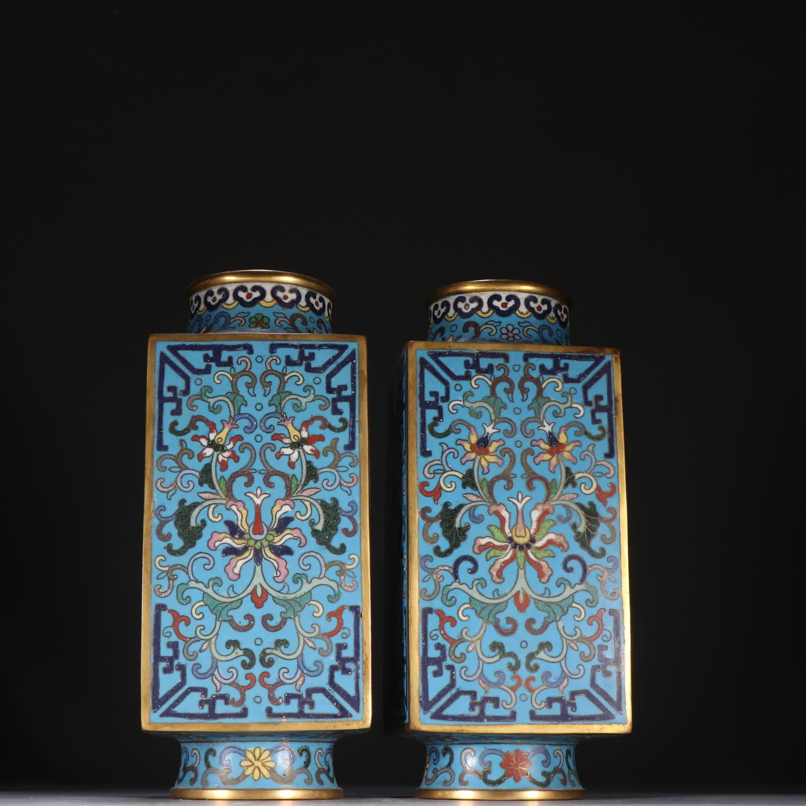A pair of Qing Dynasty copper gilt cloisonné entwined lotus pattern square bottles: A pair of copper gilt cloisonné entwined lotus pattern square bottles in the Qing Dynasty SIZE: H:18.8cm W:7.7cm W:999.5g (The Dimensions Of All Batches Are Manually Measured.If You Need More Detaile