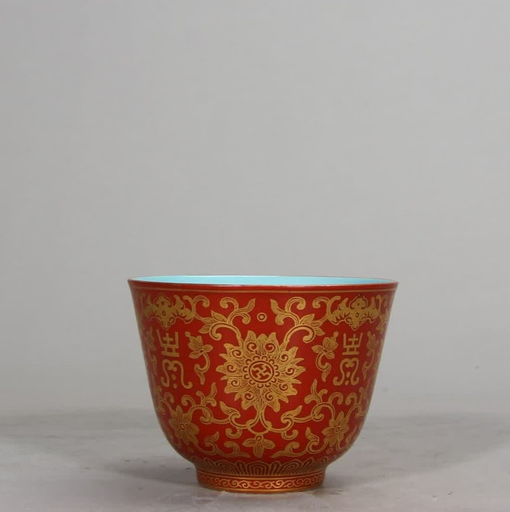 A Qing Dynasty Qianlong alum red gold-painted treasure flower tea garden (1 of 9)
