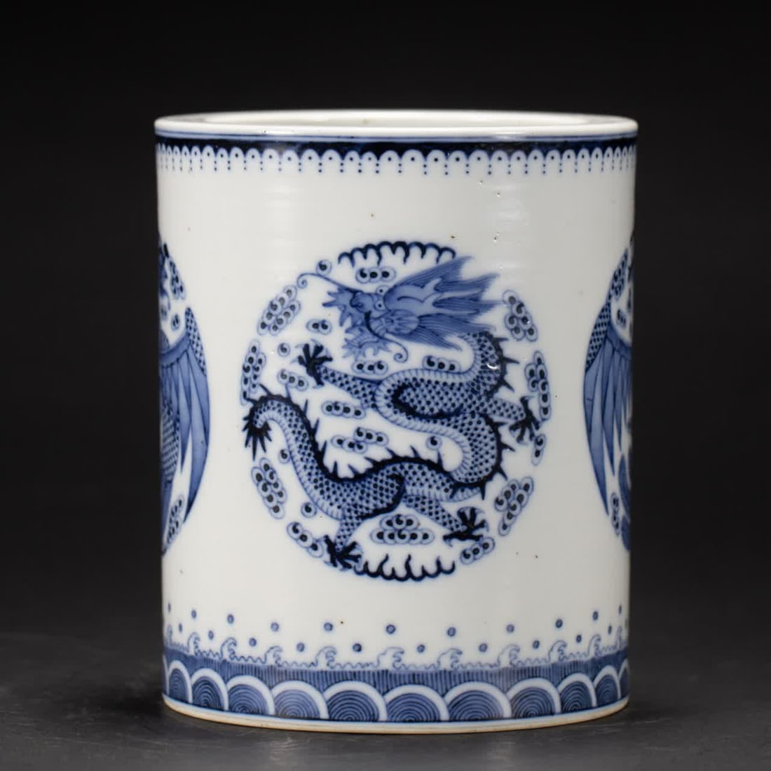 A Qing Dynasty blue and white dragon pattern pen holder (1 of 9)