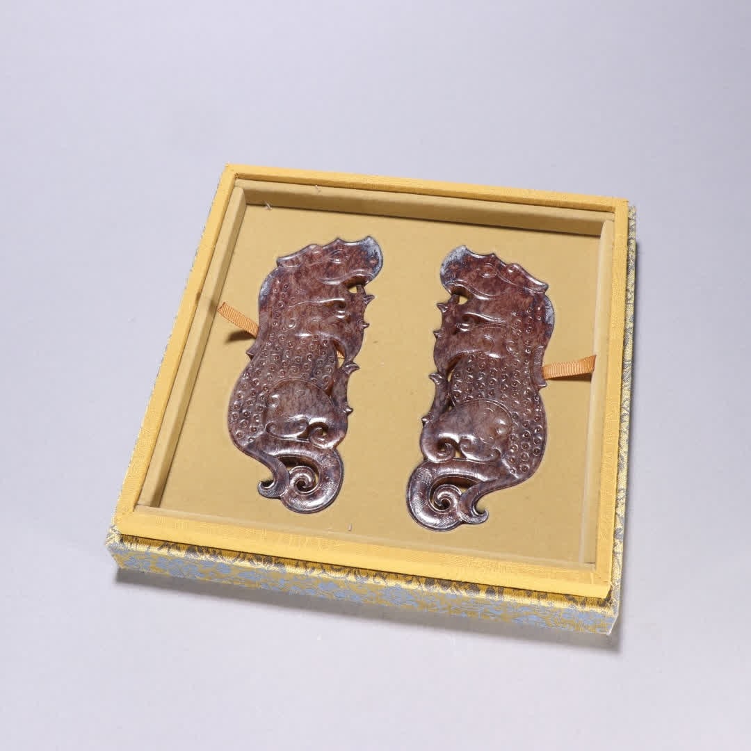 A pair of Han Dynasty Hetian jade tiger pendants (1 of 9)
