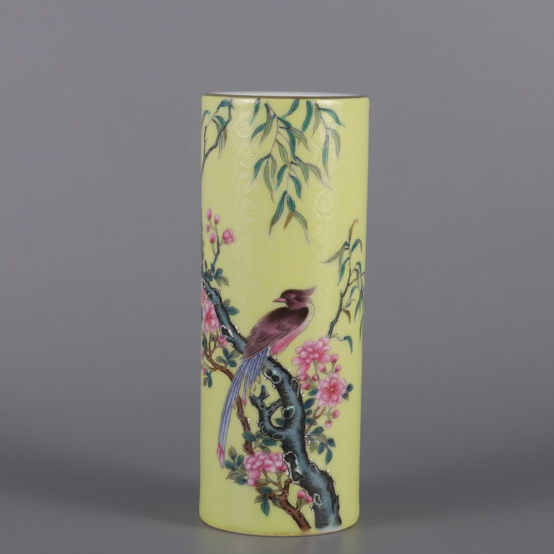 A Qing Dynasty Yongzheng year yellow floor pastel flower and bird pattern pen holder: Qing Dynasty Yongzheng year yellow ground powder color flower and bird pattern pen holder SIZE: H:15cm MouthD:5.6cm (The Dimensions Of All Batches Are Manually Measured.If You Need More Detailed Infor