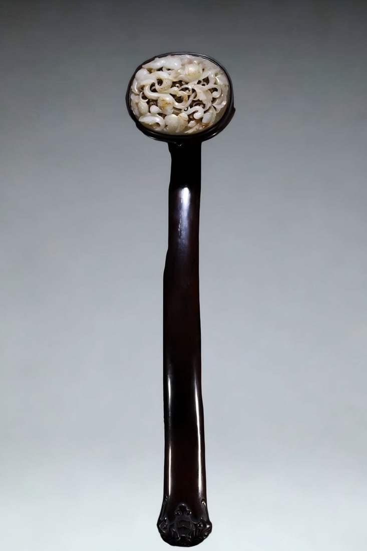 A Qing Dynasty seed material hollow carved dragon wearing flower ruyi ornament (1 of 9)
