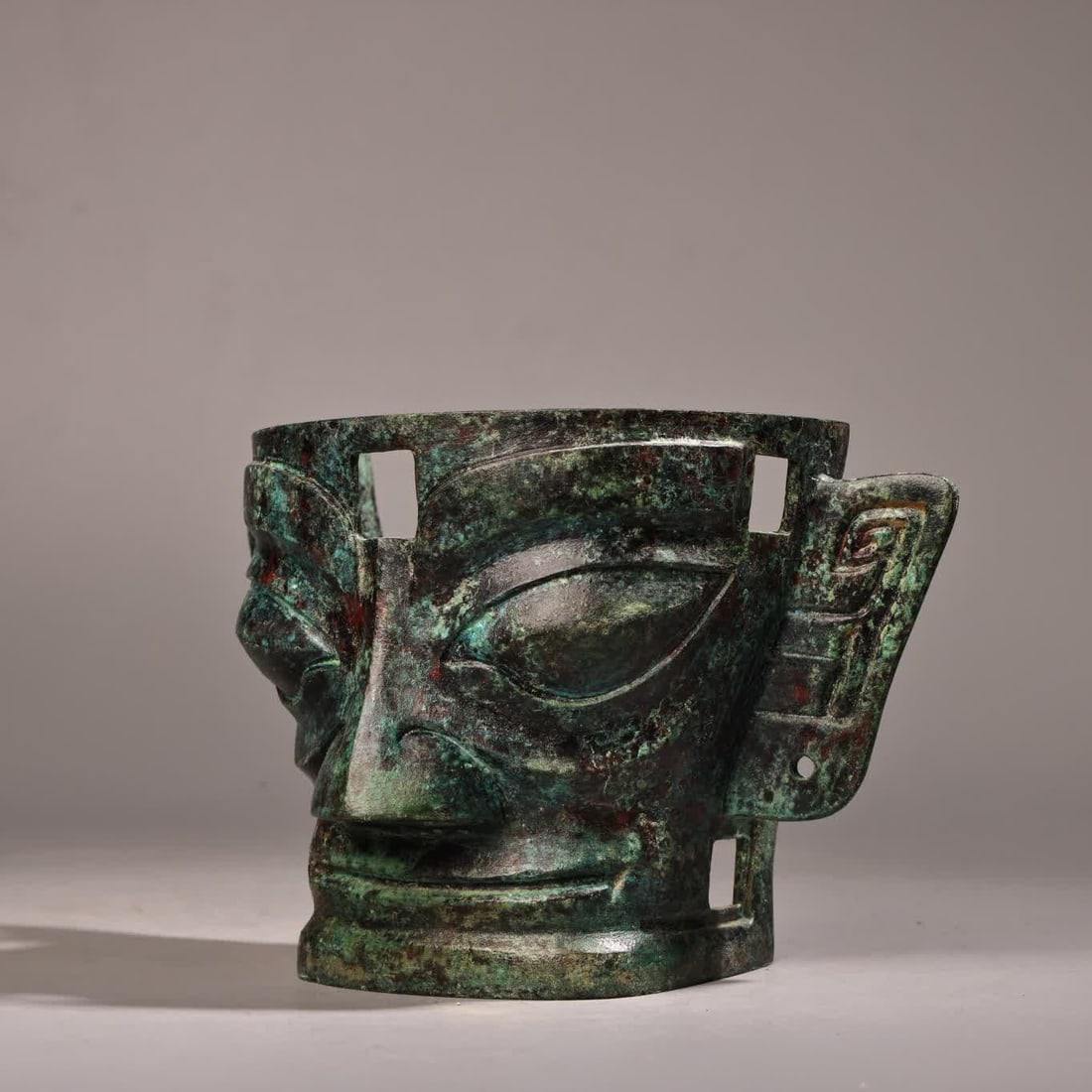 A bronze three-star mask - 2